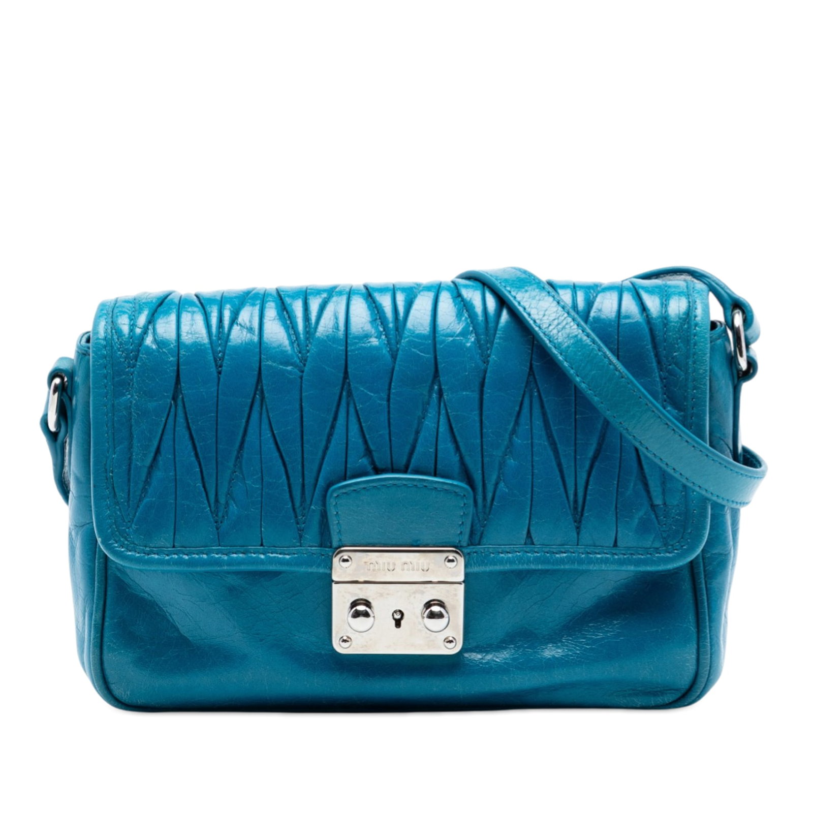 Miu Miu blue quilted lambskin flap crossbody bag: Miu Miu blue quilted lambskin flap crossbody bag This Miu Miu Matelasse Lambskin Flap Crossbody bag showcases a quilted lambskin leather exterior in blue with an adjustable flat leather strap. It feat