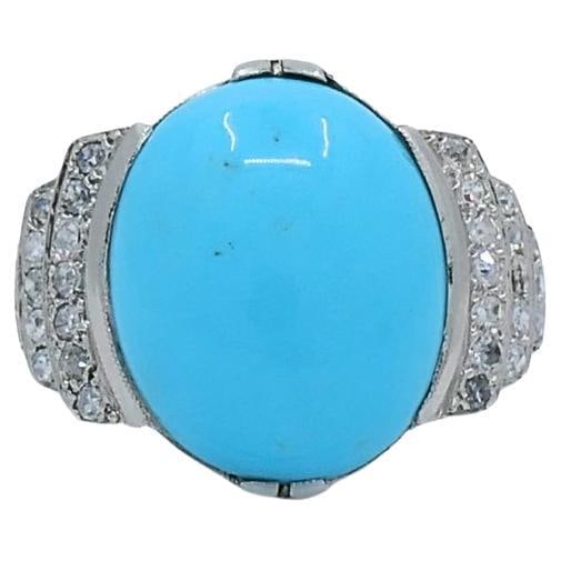 18k White Gold Turquoise Diamond Ring French Early 20th Century: 18k White Gold Turquoise Diamond Ring French Early 20th Century Early 20th century French ring featuring a cabochon turquoise accented by diamonds in an 18k white gold setting. The design centers on a
