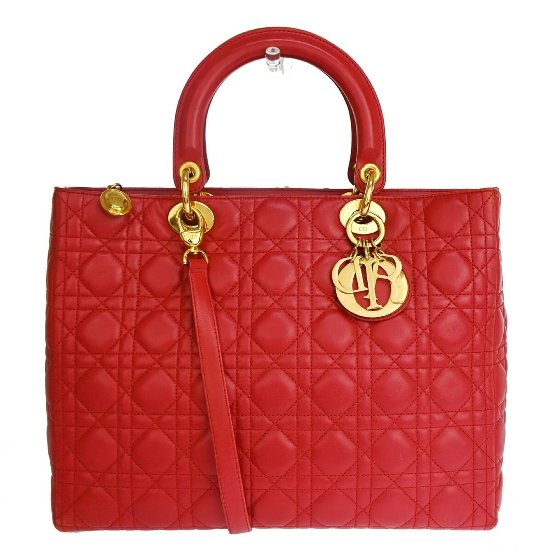 Christian Dior Lady Dior Vintage Red Leather Handbag: Christian Dior Lady Dior Vintage Red Leather Handbag This vintage Lady Dior bag features the iconic Cannage quilt design in red lambskin leather. Made in Italy, it is designed for women and showcases 