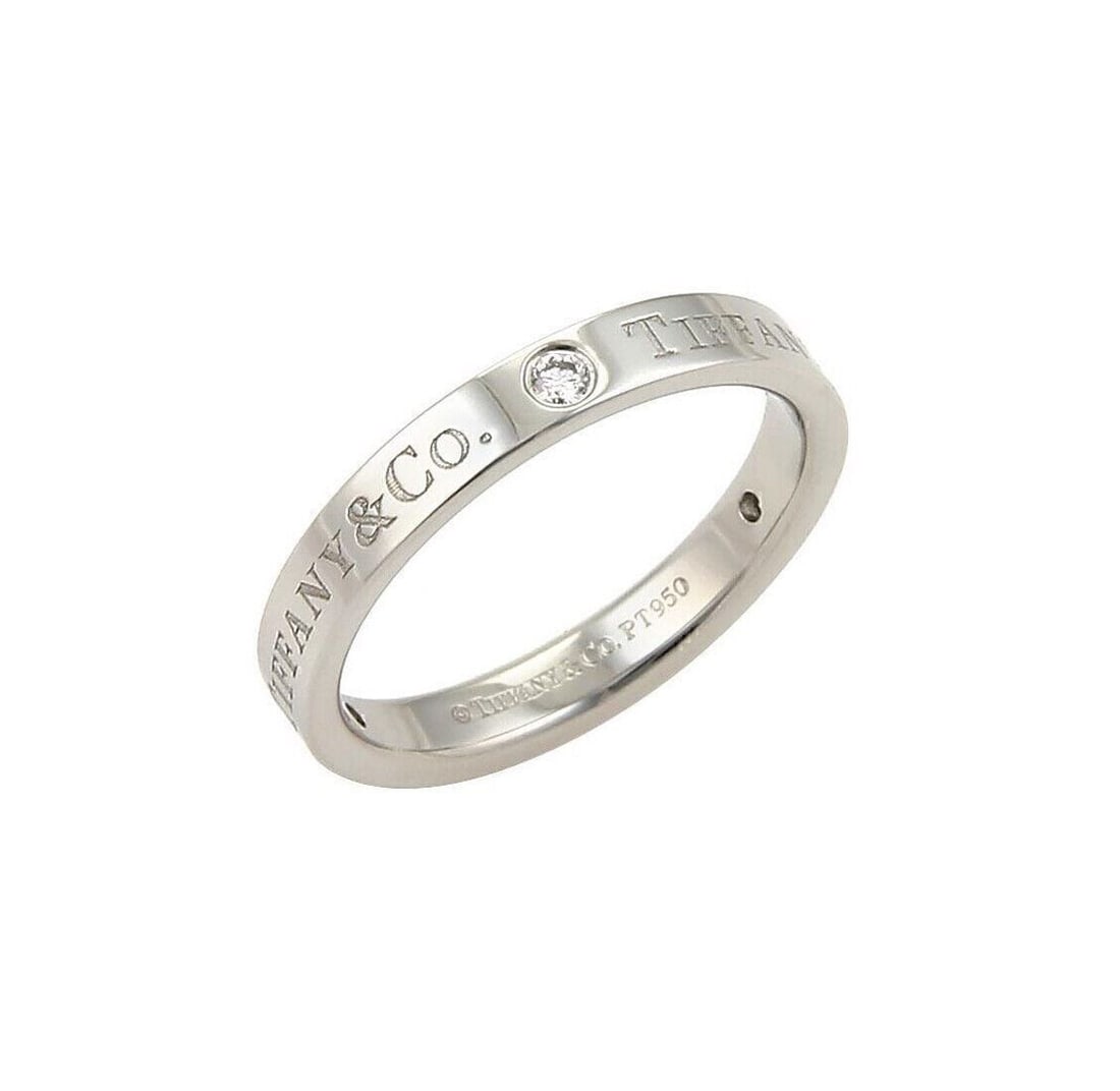 Tiffany & Co. Three Diamond Flat Band Ring in PT950 Platinum Size 6: Tiffany & Co. Three Diamond Flat Band Ring in PT950 Platinum Size 6 Signed Tiffany & Co. three diamond flat band ring in PT950 platinum. This pre-owned ring features a flat polished band with three fl