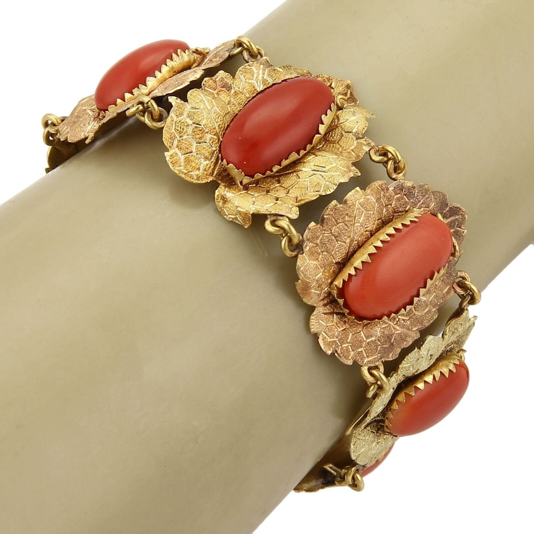 Vintage 18k Two Tone Gold Coral Leaf Link Bracelet 7": Vintage 18k Two Tone Gold Coral Leaf Link Bracelet 7" Vintage estate link bracelet with a sculptural textured leaf motif, accented by coral cabochons. Crafted in solid 18k two-tone gold, this original