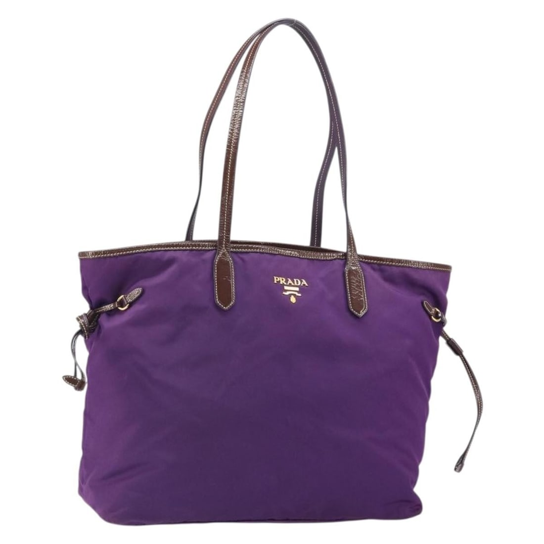 Prada Purple Nylon Tote with Gold Accents Made in Italy: Prada Purple Nylon Tote with Gold Accents Made in Italy This PRADA tote bag is crafted from purple nylon with gold-tone accents. Designed for women, the bag features a spacious interior and durable ha
