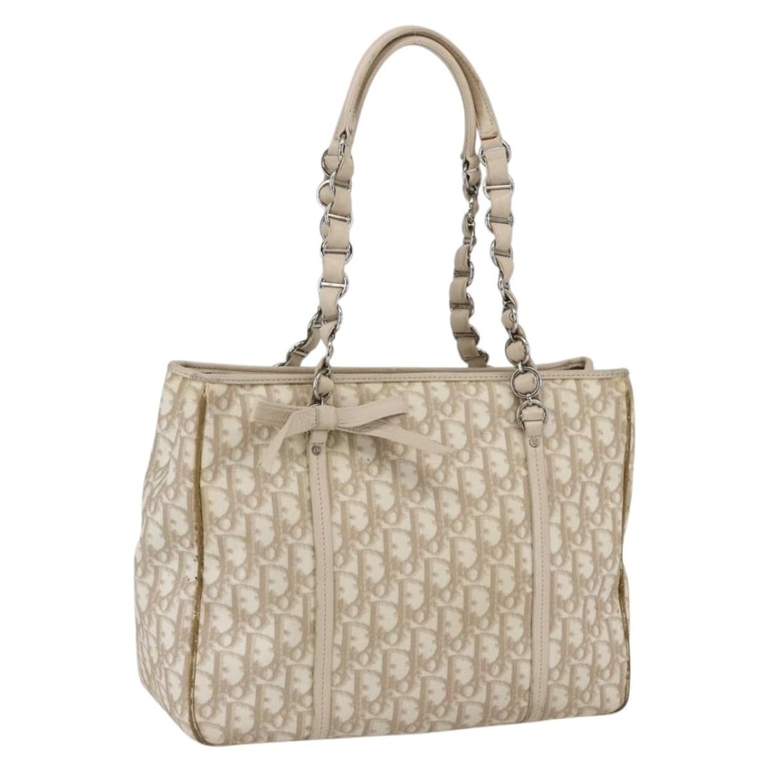Christian Dior Romantic Beige Silver PVC Trotter Canvas Handbag Italy: Christian Dior Romantic Beige Silver PVC Trotter Canvas Handbag Italy This Christian Dior Trotter Canvas Romantic Hand Bag features a beige and silver color scheme and is crafted from PVC leather and 