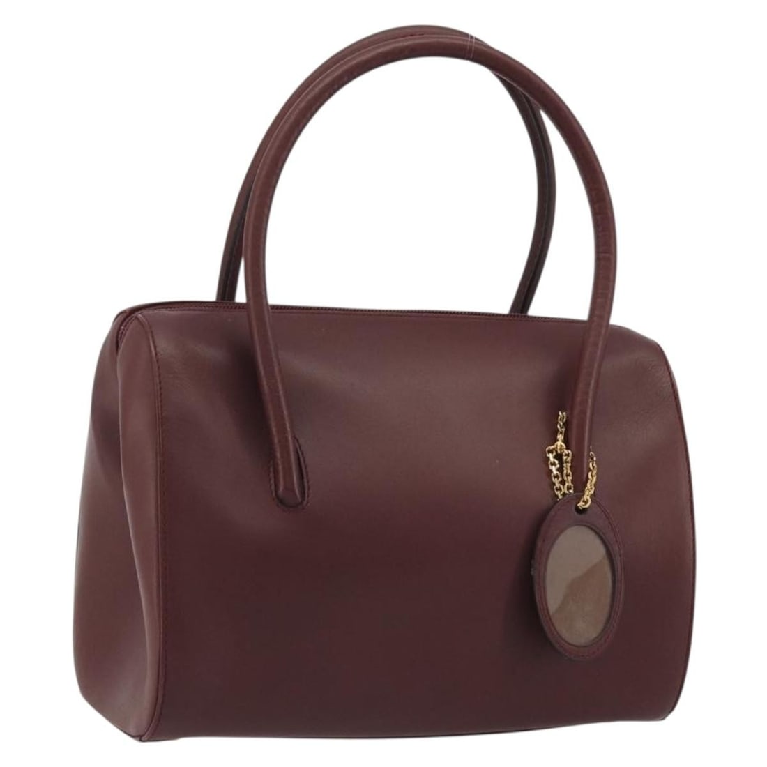 Cartier Must Line Bordeaux Leather Handbag Gold Tone Spain: Cartier Must Line Bordeaux Leather Handbag Gold Tone Spain Cartier Must Line handbag in bordeaux leather with gold-tone accents. Made in Spain, this women's handbag shows heavy use with rubbing, stain