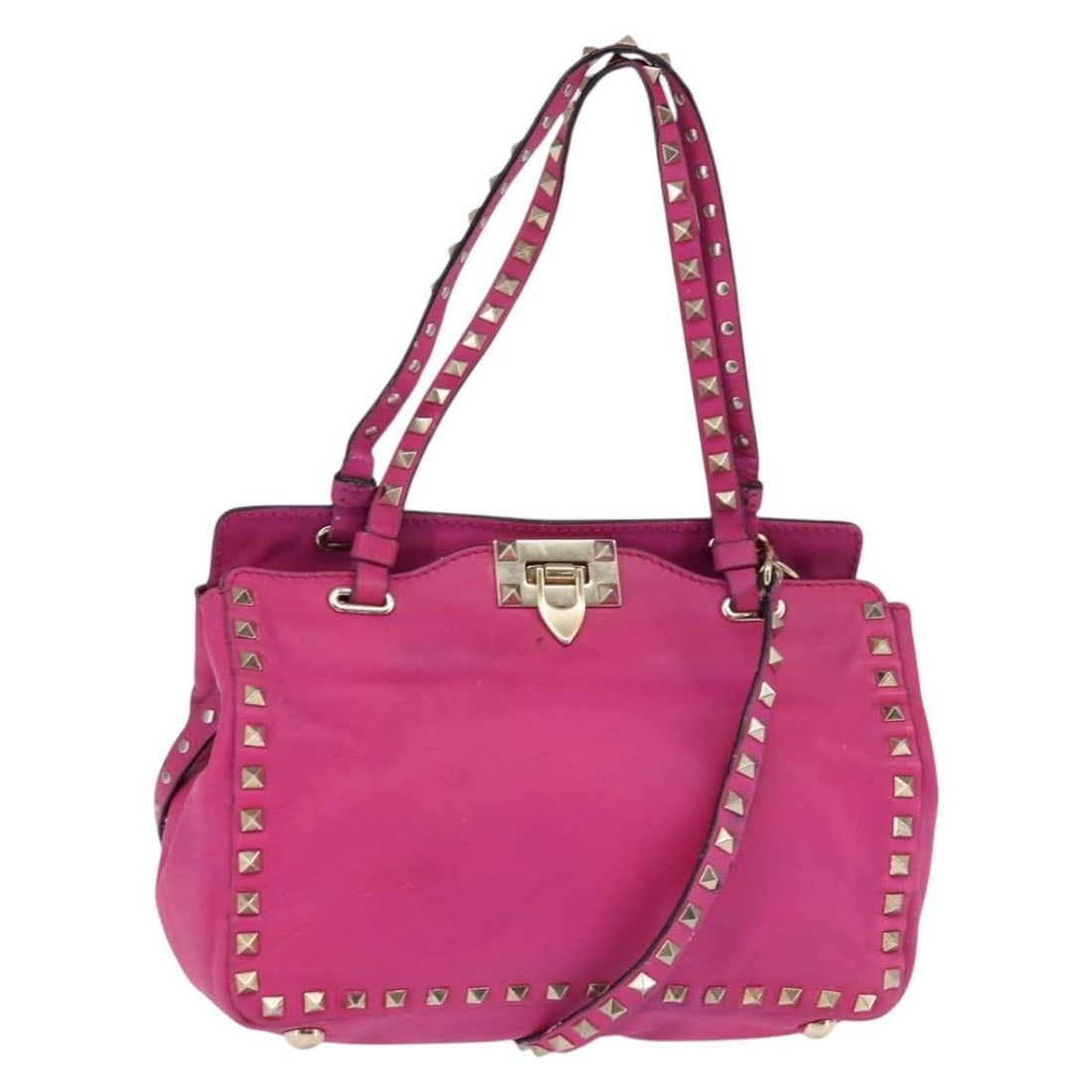 VALENTINO Pink Leather 2way Handbag with Studs and Shoulder Strap: VALENTINO Pink Leather 2way Handbag with Studs and Shoulder Strap Valentino 2-way handbag in pink leather with gold-tone accents and stud detailing. Made in Italy, this women's bag includes a shoulder