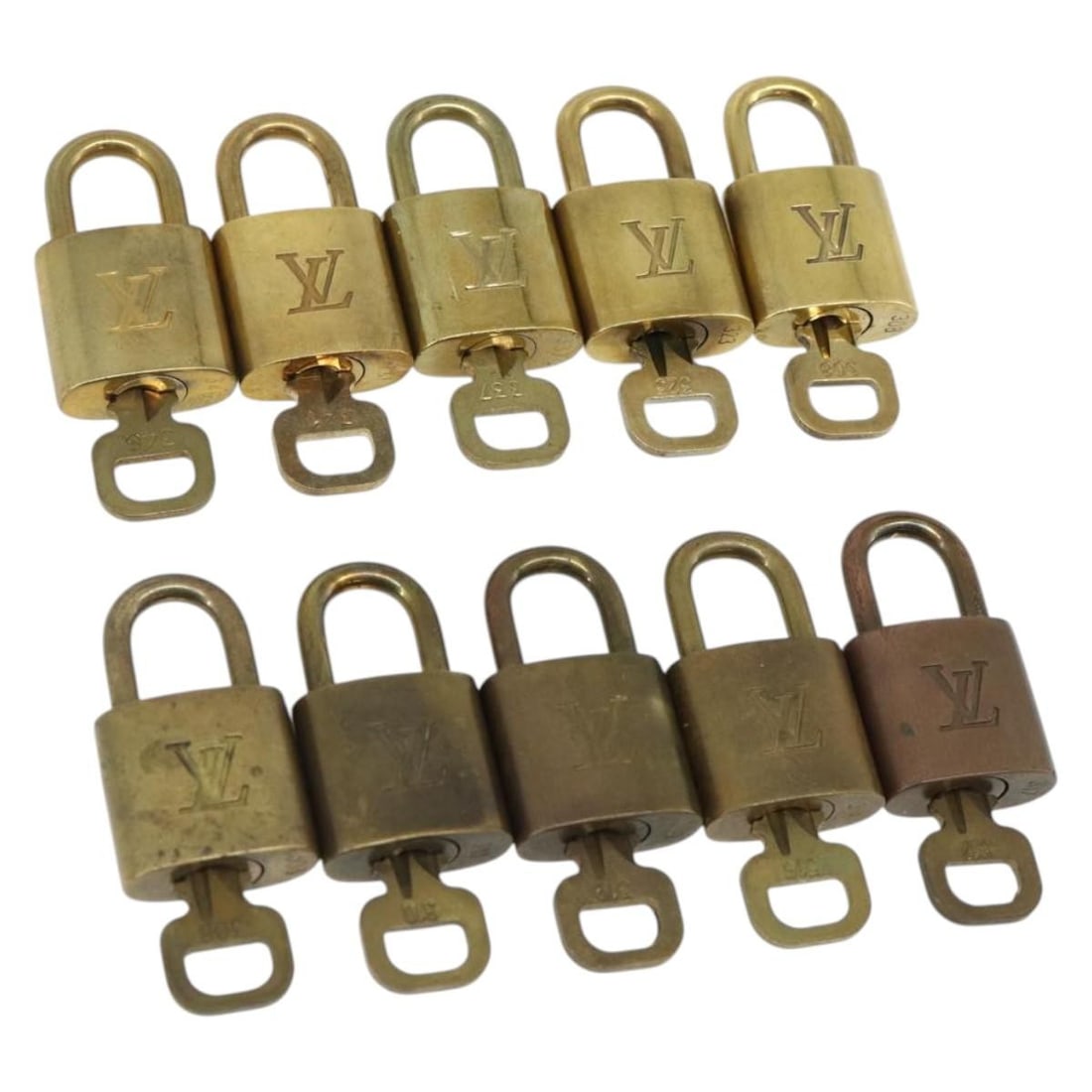 Louis Vuitton Gold Metal Padlock Set Made in France: Louis Vuitton Gold Metal Padlock Set Made in France Set of 10 Louis Vuitton metal padlocks in gold tone, made in France. This bundle includes only the items shown in the photo and does not include a b