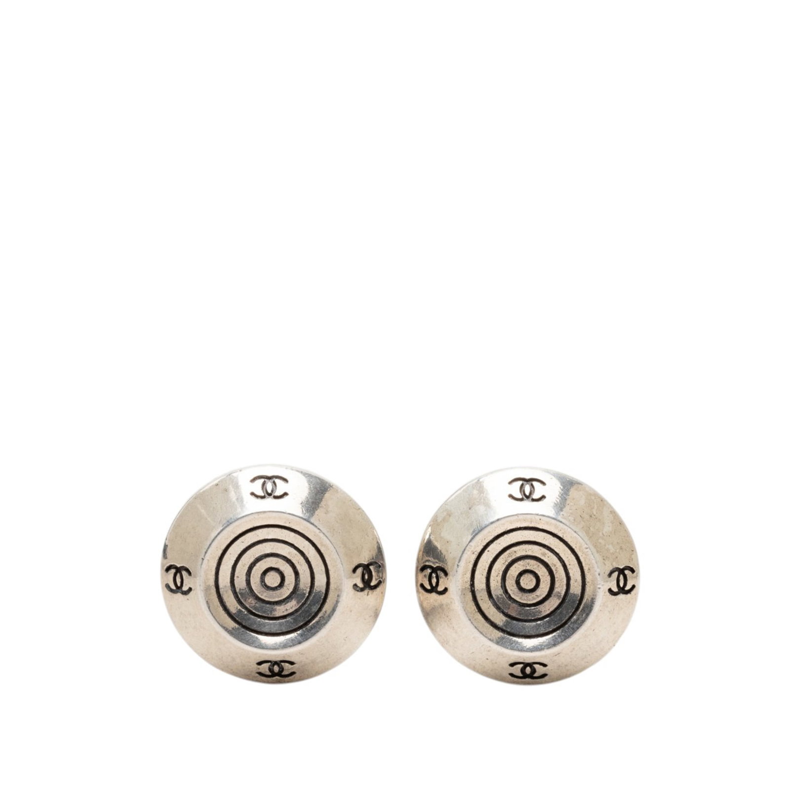 Chanel CC Round Clip On Earrings Silver Tone Metal: Chanel CC Round Clip On Earrings Silver Tone Metal Round Chanel clip-on earrings with a silver tone metal body and CC target design. This costume jewelry piece is made in France and shows wear consist