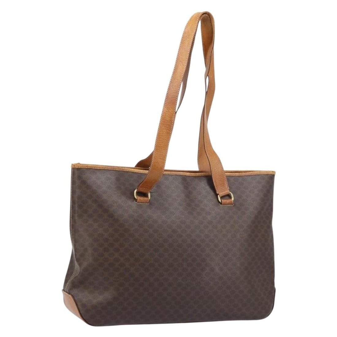 Celine Macadam Brown PVC Canvas Tote with Gold Accents and Leather Trim: Celine Macadam Brown PVC Canvas Tote with Gold Accents and Leather Trim This CELINE Macadam tote bag features a combination of PVC leather and Macadam canvas in a brown and gold color scheme. Designed