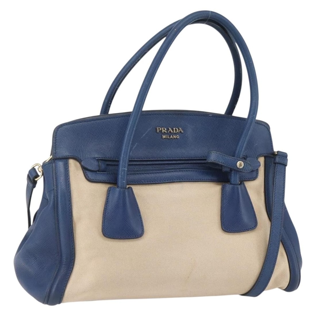 Prada Beige Blue Canvas 2way Handbag with Shoulder Strap: Prada Beige Blue Canvas 2way Handbag with Shoulder Strap This PRADA 2-way handbag is crafted from beige and blue canvas and can be carried by hand or worn with the removable shoulder strap. Made in It