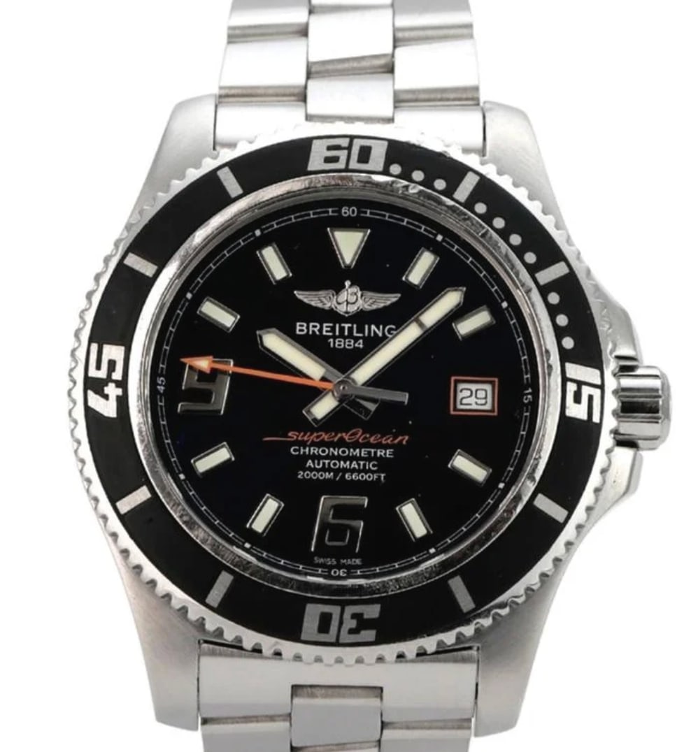 Breitling Superocean Heritage mens watch black dial steel bracelet papers: Breitling Superocean Heritage mens watch black dial steel bracelet papers Breitling Superocean Heritage men's watch featuring a black dial, rotating bezel, and stainless steel bracelet. This example i