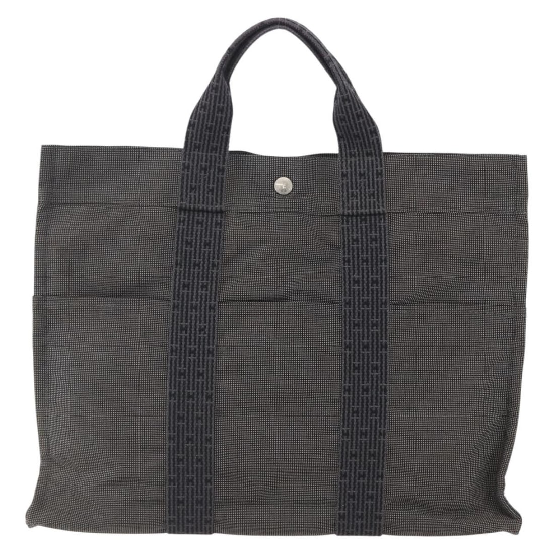 Hermes Fourre-tout Herline gray canvas tote bag 44cm: Hermes Fourre-tout Herline gray canvas tote bag 44cm This Hermes Fourre-tout Herline tote is crafted from gray canvas and designed for women. The bag features a spacious interior with multiple pockets
