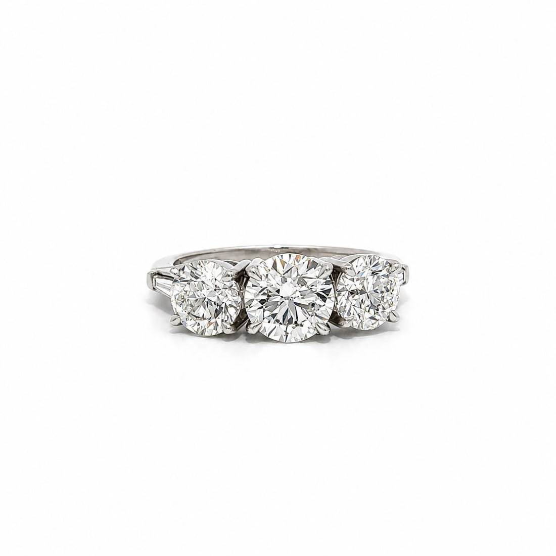 Platinum 3 Stone Diamond Ring 3.13ctw GIA Certified Baguette Accents: Platinum 3 Stone Diamond Ring 3.13ctw GIA Certified Baguette Accents Handmade 3-stone cocktail ring crafted in solid .900+ platinum and set with natural genuine diamonds. The center arrangement featur