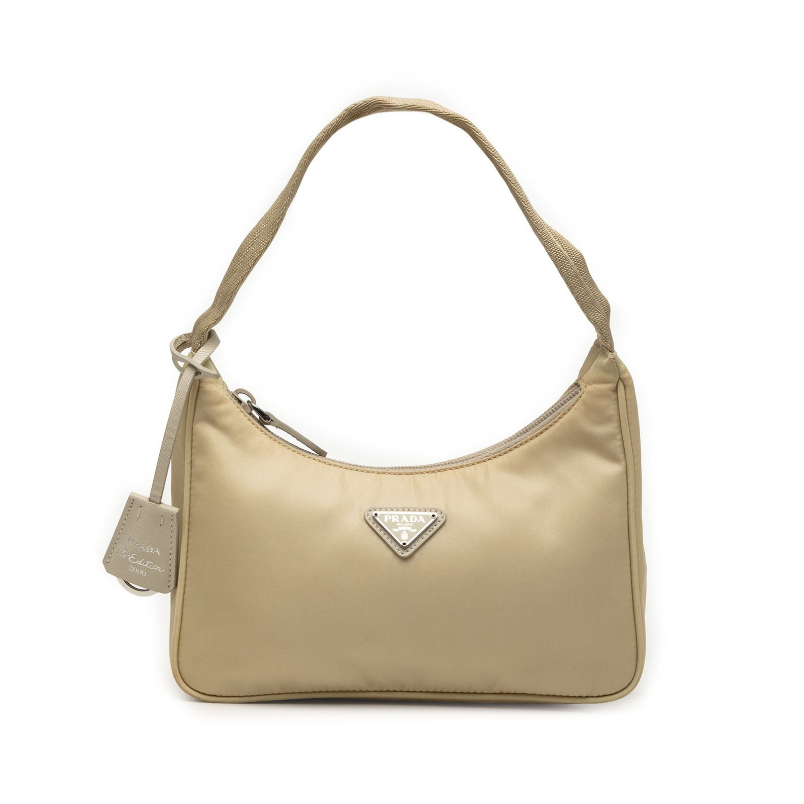 Prada Re Edition 2000 Mini Tessuto Nylon Shoulder Bag Beige: Prada Re Edition 2000 Mini Tessuto Nylon Shoulder Bag Beige Prada Mini Tessuto Re Edition 2000 Shoulder Bag in beige fabric with a nylon body, flat strap, and top zip closure. Made in Italy, this bag 