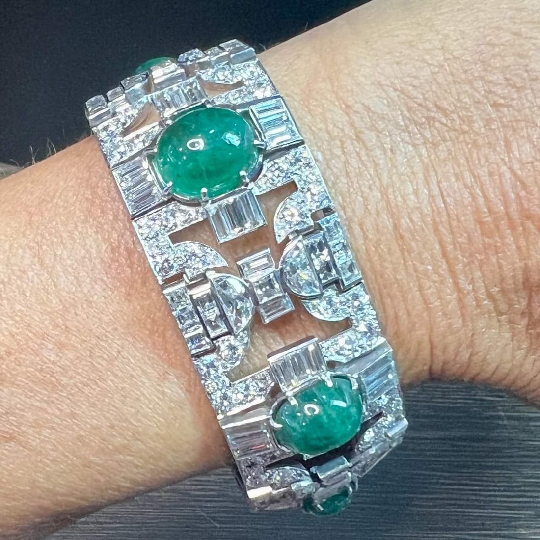 Art Deco Platinum 18K Emerald Diamond Bracelet with Hallmarks: Art Deco Platinum 18K Emerald Diamond Bracelet with Hallmarks This exquisite Art Deco bracelet is crafted from platinum and 18K gold, showcasing a stunning array of gemstones. It features five vibrant