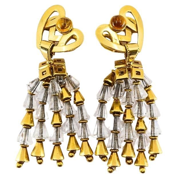 Fred Leighton 18k Gold Dangle Earrings with Citrine Rock Crystal: Fred Leighton 18k Gold Dangle Earrings with Citrine Rock Crystal 1950s dangle earrings in 18k yellow gold, detailed with citrine and rock crystal. They feature a heart motif and a clip-on style, and a