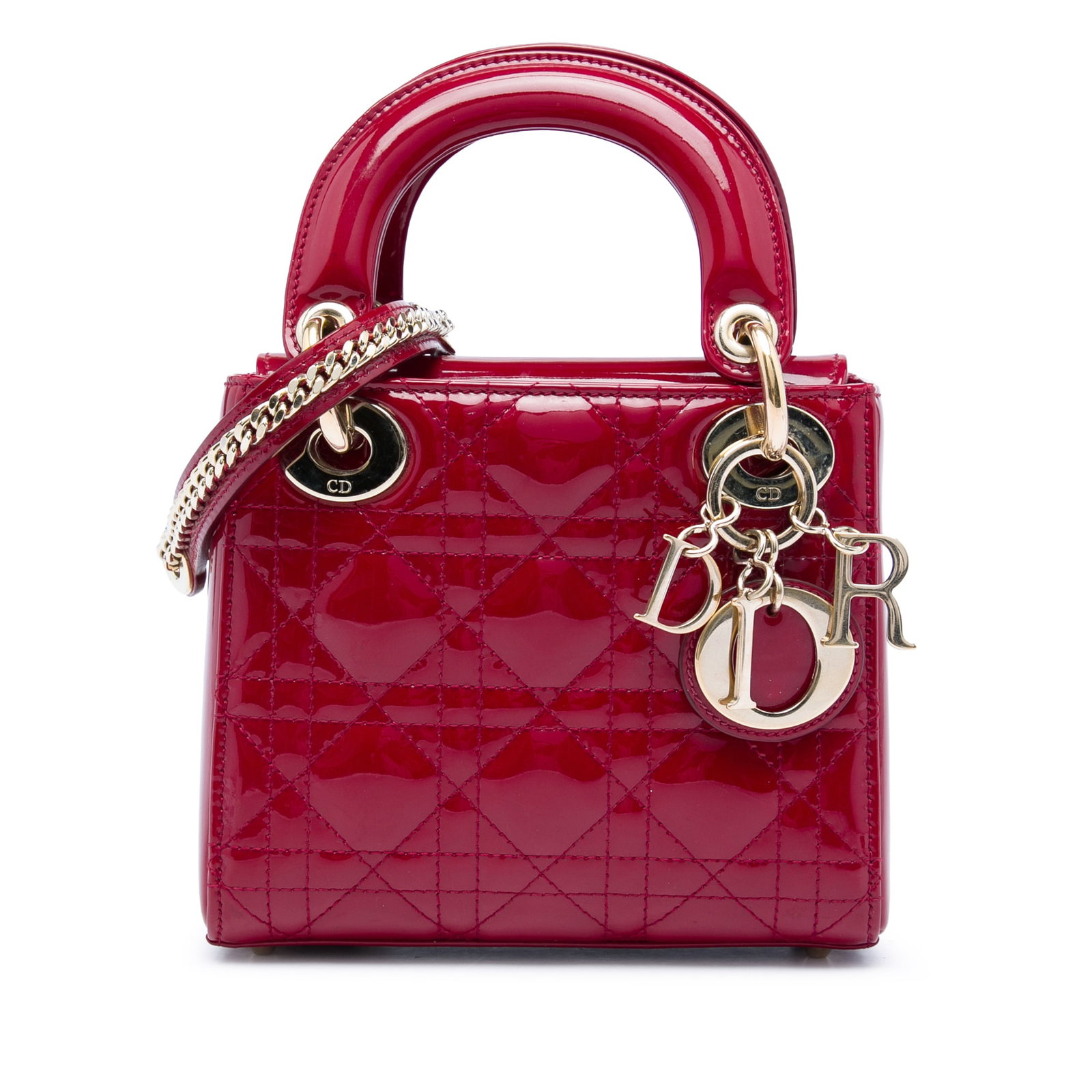 Dior Lady Dior Mini red patent leather handbag: Dior Lady Dior Mini red patent leather handbag Mini Lady Dior bag in red patent leather with Cannage quilting. This bag features flat top handles, a detachable flat leather strap, a flap closure, and 