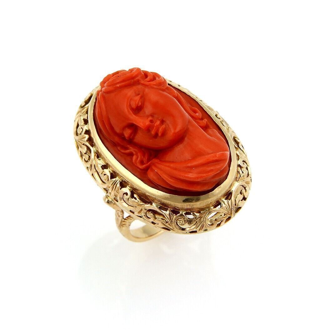 18k Yellow Gold Coral Cameo Ring Woman Motif Size 7: 18k Yellow Gold Coral Cameo Ring Woman Motif Size 7 Vintage estate ring featuring a deep carved coral cameo depicting a woman, set in 18k yellow gold. This pre-owned piece has a bold sculptural look a