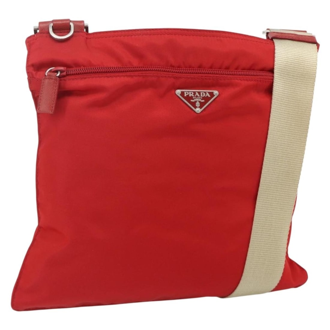 Prada Red Nylon Shoulder Bag with Guarantee Card: Prada Red Nylon Shoulder Bag with Guarantee Card Authentic Prada shoulder bag in red nylon with silver-tone accents. Made in Italy, this women's bag includes the guarantee card and features an adjusta