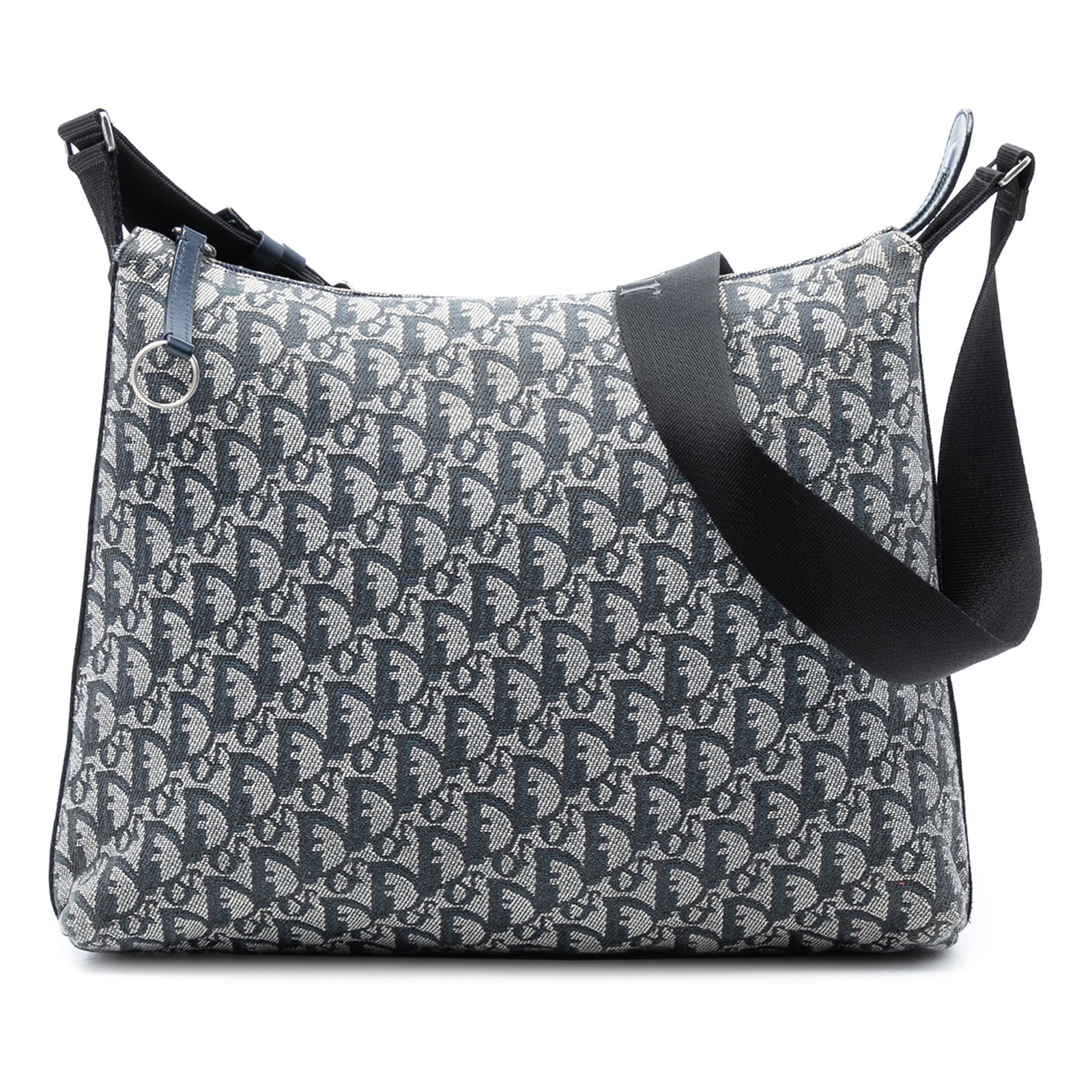 Dior Diorissimo Trotter Blue Canvas Crossbody Shoulder Bag: Dior Diorissimo Trotter Blue Canvas Crossbody Shoulder Bag This Diorissimo Trotter Canvas Crossbody features a blue fabric body with the iconic Dior pattern, an adjustable flat shoulder strap, a top z