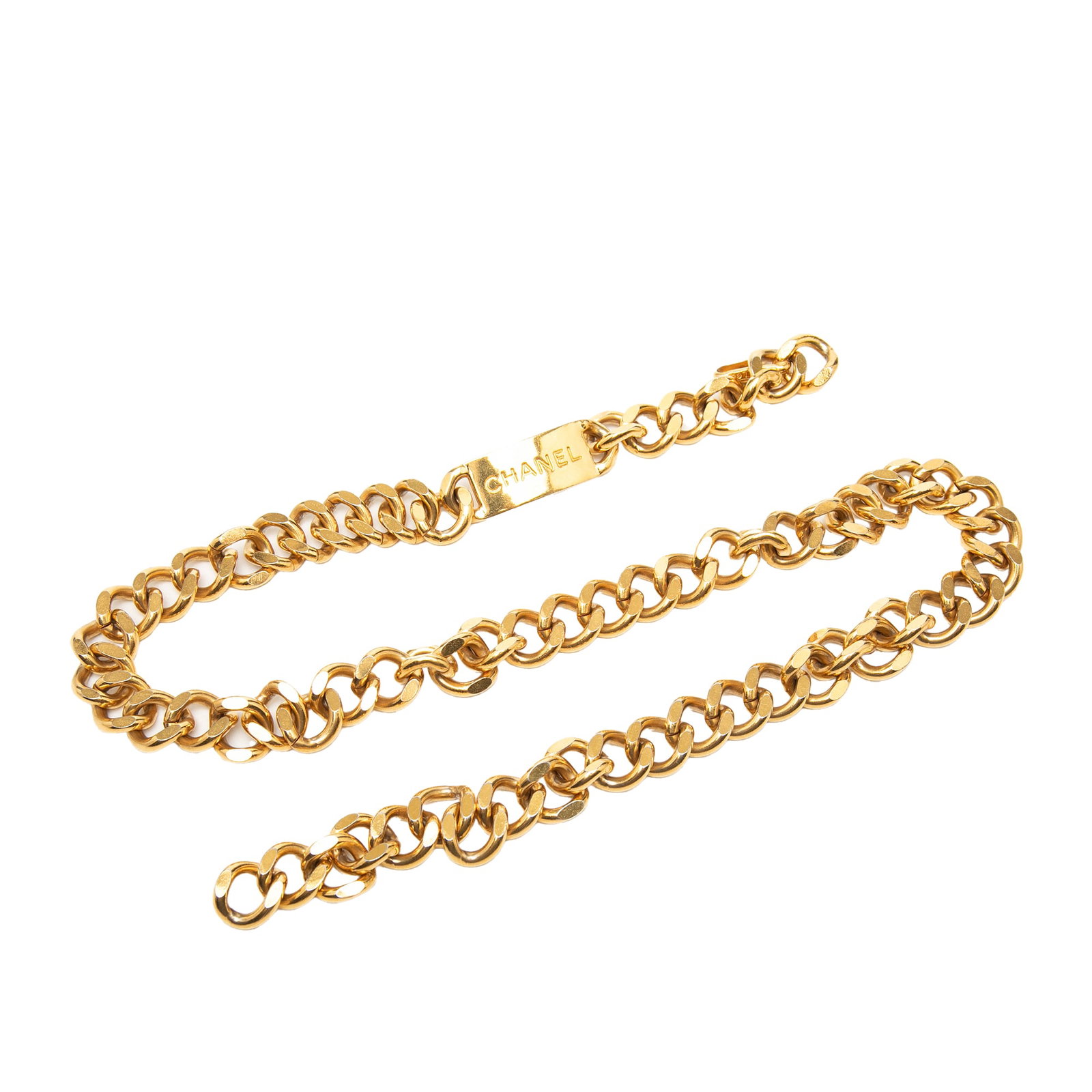 Chanel chain belt with gold plated logo plate: Chanel chain belt with gold plated logo plate This Chanel belt features a gold plated metal body with a logo plate and a chain design, secured by a hook closure. Made in France, the belt showcases a g