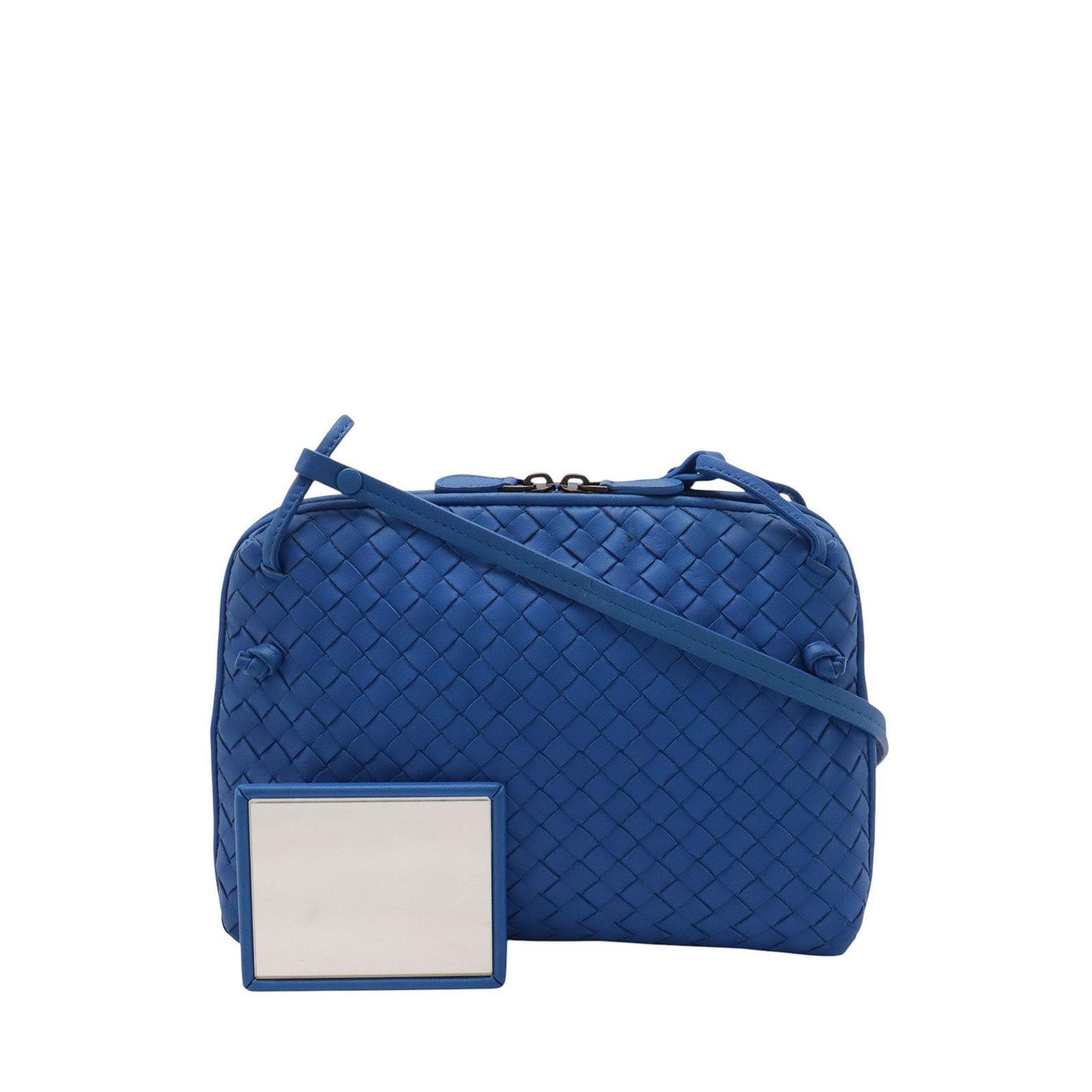 Bottega Veneta Nodini Blue Intrecciato Leather Crossbody Bag: Bottega Veneta Nodini Blue Intrecciato Leather Crossbody Bag Bottega Veneta Nodini crossbody bag crafted in blue nappa intrecciato leather. This crossbody style features a flat leather strap, a two-wa