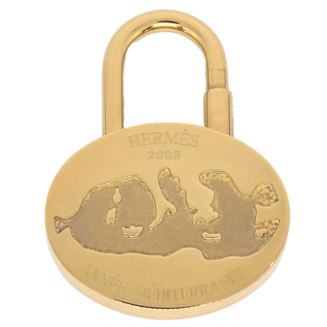 Hermes Mediterranean 2003 Gold Plated Cadena Bag Charm: Hermes Mediterranean 2003 Gold Plated Cadena Bag Charm Hermes Mediterranean Cadena padlock bag charm from 2003, made in France. This gold-plated piece is presented in very good condition with visible 