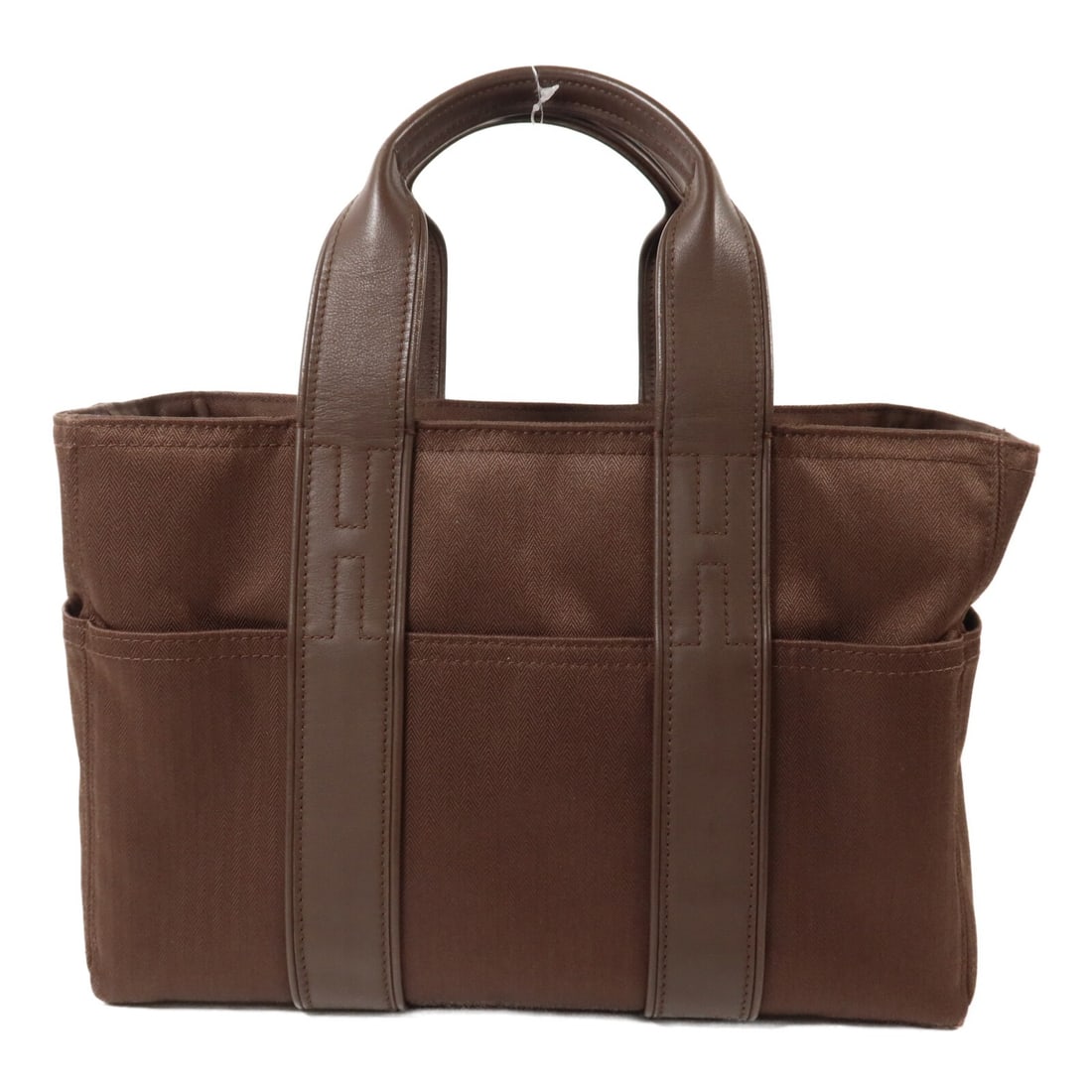 Hermes Acapulco PM Canvas Tote Handbag Dark Brown PHW: Hermes Acapulco PM Canvas Tote Handbag Dark Brown PHW Hermes Acapulco PM tote handbag in dark brown canvas with palladium-tone hardware. This women's handbag features multiple exterior open pockets an