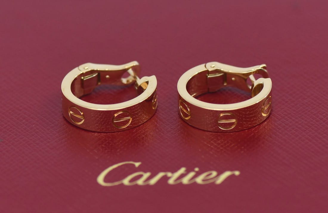 Cartier Love Huggie Earrings 18K Yellow Gold with Box Certificate: Cartier Love Huggie Earrings 18K Yellow Gold with Box Certificate Pre-owned Cartier Love huggie earrings in 18k yellow gold. This pair features the iconic Love theme design and comes with the box and 