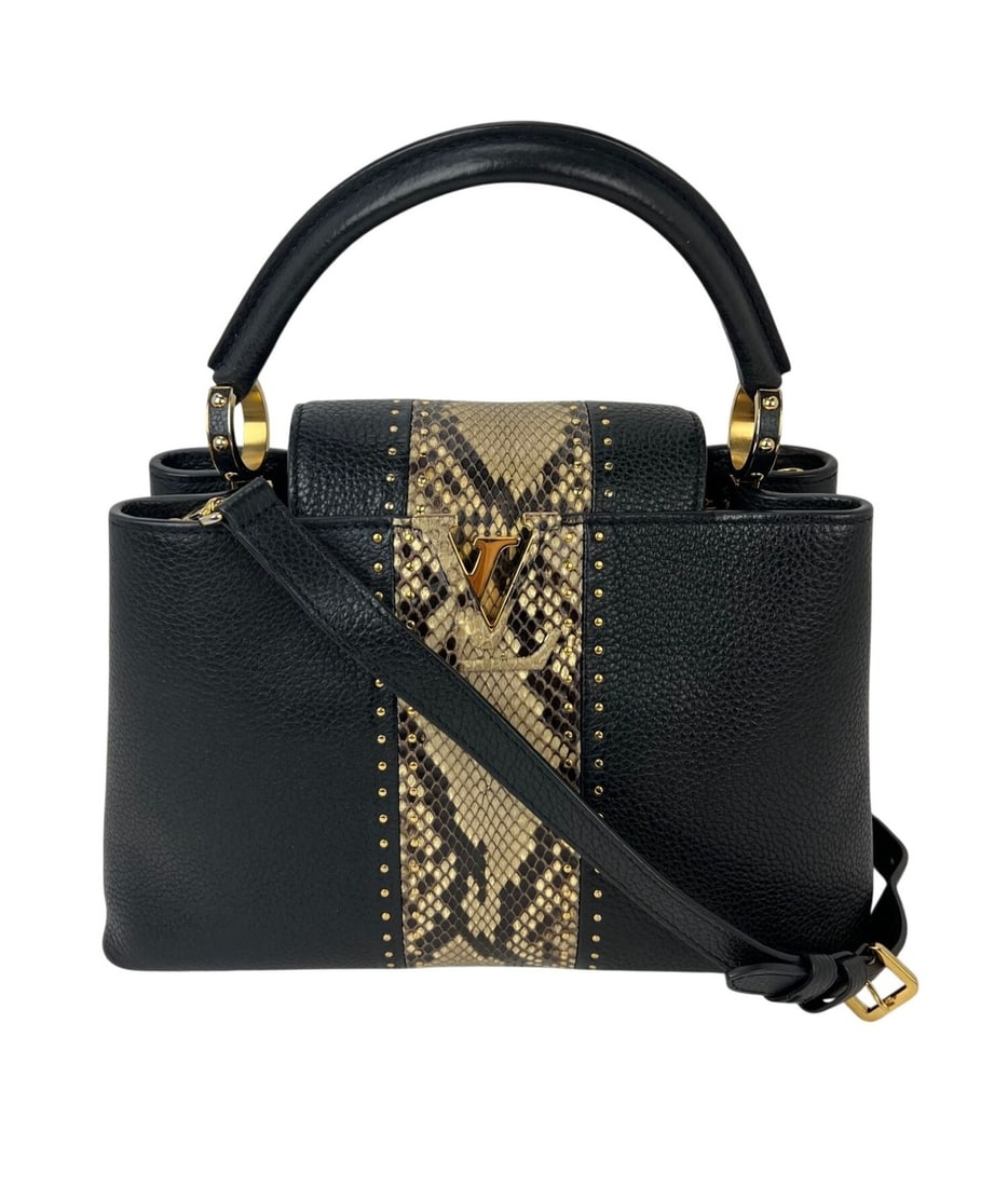 Louis Vuitton Capucines MM Black Taurillon Leather Shoulder Bag: Louis Vuitton Capucines MM Black Taurillon Leather Shoulder Bag Pre-owned Louis Vuitton Capucines MM shoulder bag in black taurillon leather with a structured trapezoid silhouette. This women's bag fe