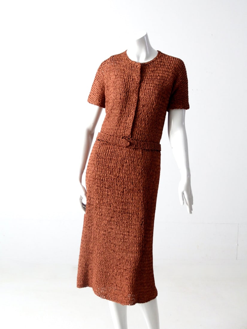 1940s Vintage Coppery-Brown Knit Ribbon Dress with Slip: 1940s Vintage Coppery-Brown Knit Ribbon Dress with Slip Step back in time with this exquisite 1940s vintage knit ribbon dress, featuring a stunning coppery-brown hue. This elegant piece boasts a snap 
