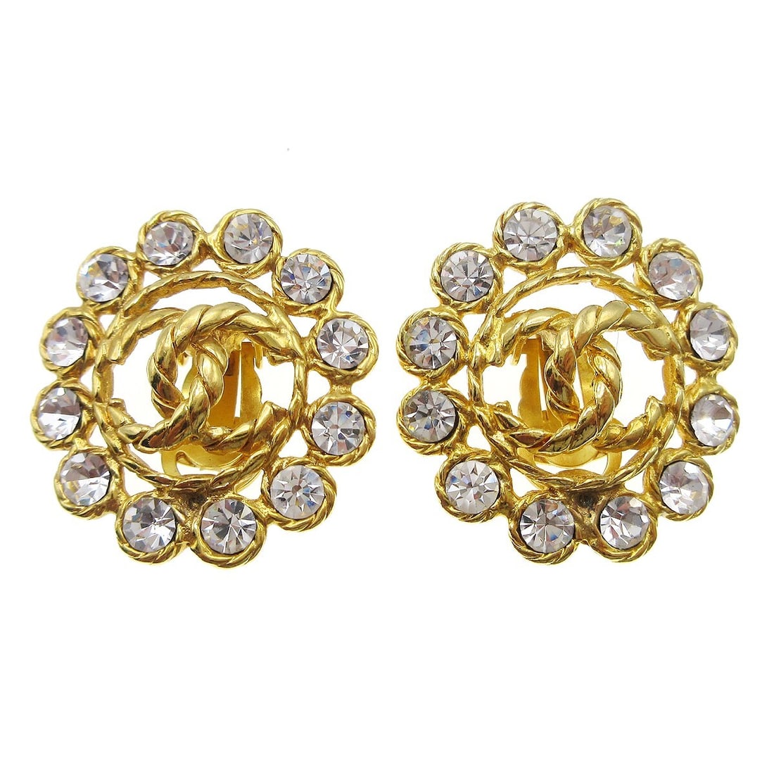 Chanel CC Logo Button Clip On Earrings Gold Plated Rhinestone: Chanel CC Logo Button Clip On Earrings Gold Plated Rhinestone Clip-on Chanel button motif earrings featuring the CC logo and rhinestone detailing. Finished in gold-plated metal, this pair is made in F