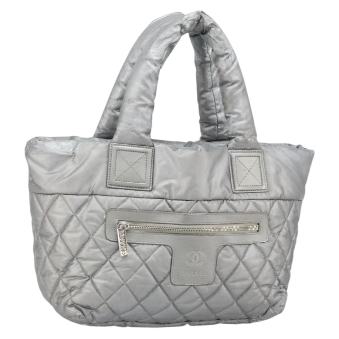 Silver Coated Canvas Tote Bag by CHANEL Made in Italy bs33124: Silver Coated Canvas Tote Bag by CHANEL Made in Italy bs33124 This Chanel Cococoon Tote Bag features a silver coated canvas exterior with silver metal fittings. Made in Italy, it measures approximatel