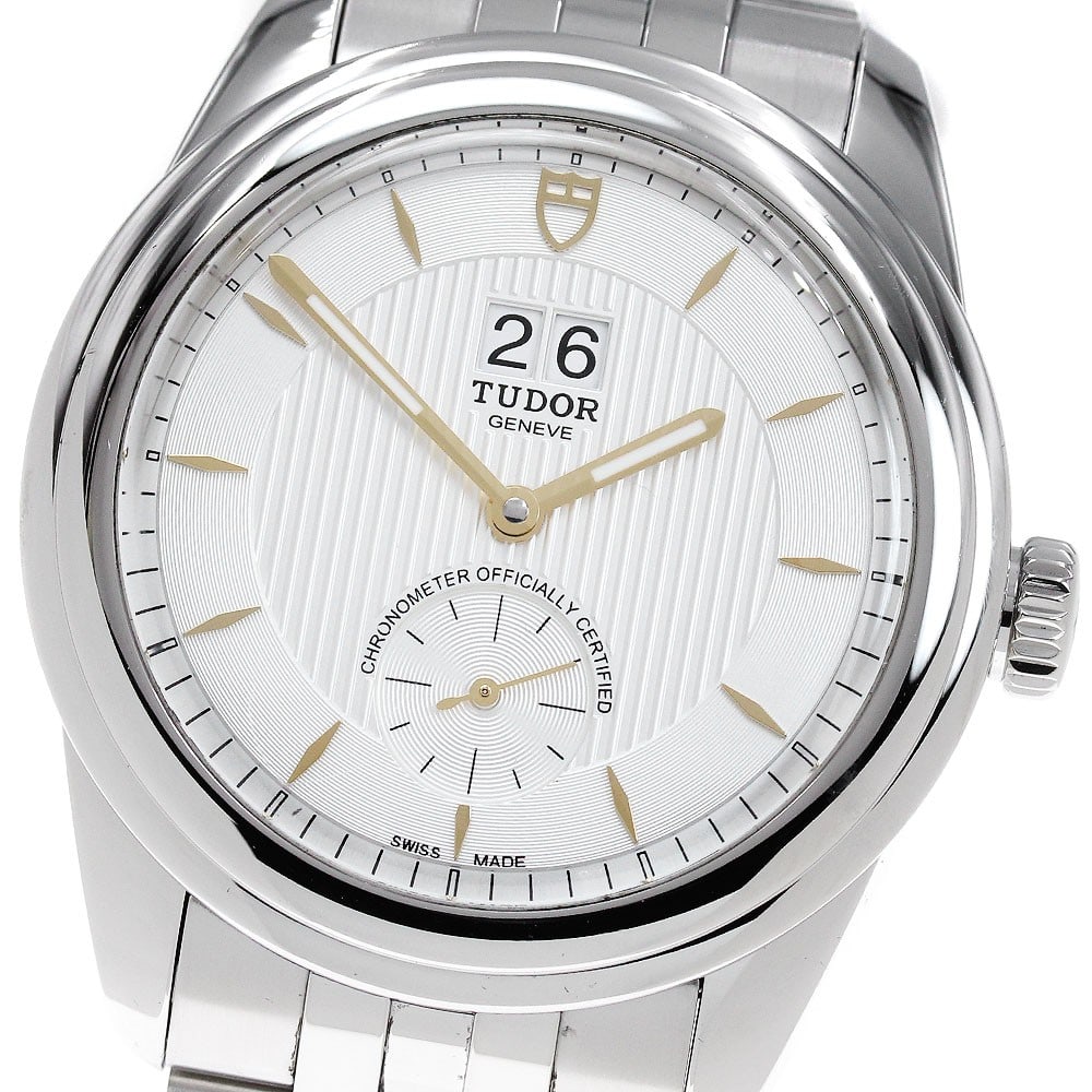 TUDOR Glamour 57100 mens automatic stainless steel wristwatch: TUDOR Glamour 57100 mens automatic stainless steel wristwatch Pre-owned TUDOR Glamour Double Date automatic men's wristwatch with a silver dial and stainless steel case and bracelet. Features include 