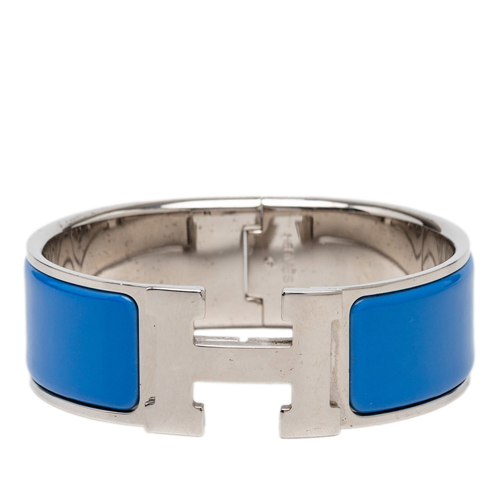 Hermes Clic Clac H PM wide enamel bracelet blue: Hermes Clic Clac H PM wide enamel bracelet blue Hermes Wide Enamel Clic Clac H Bracelet PM with an enamel body, palladium-plated metal accents, and a metal clasp closure. The bracelet is made in Franc