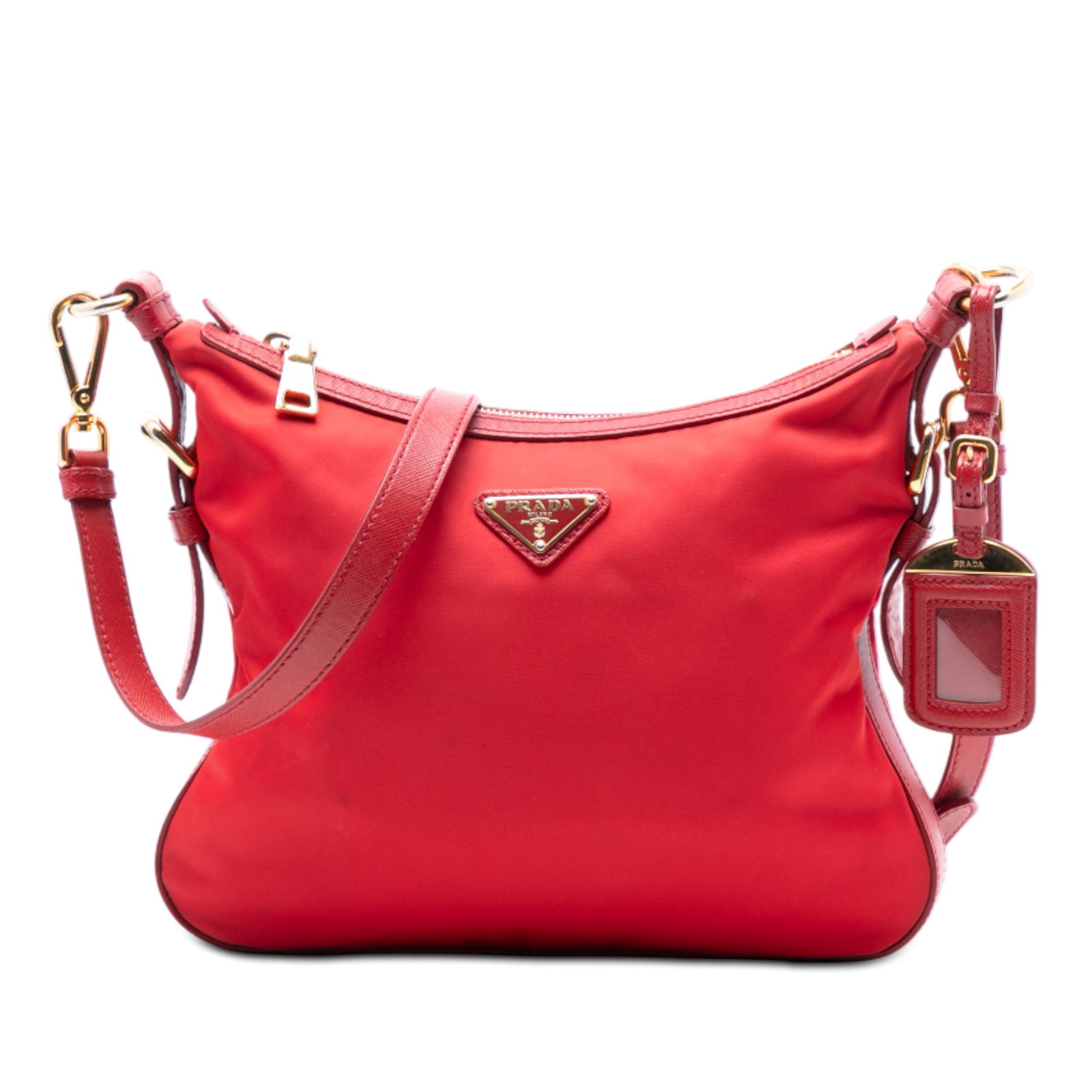 Prada Tessuto Red Nylon Crossbody Bag with Saffiano Leather Trim: Prada Tessuto Red Nylon Crossbody Bag with Saffiano Leather Trim This Prada crossbody bag features a red nylon body with saffiano leather trim, an adjustable and detachable flat saffiano strap, a top 