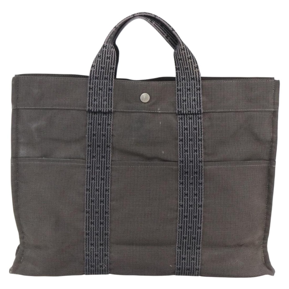 Hermes Fourre Tout tote bag in gray canvas: Hermes Fourre Tout tote bag in gray canvas This Hermes Fourre Tout Tote is crafted from gray canvas and designed for women. Made in France, it features signs of wear including surface rubbing, slight 
