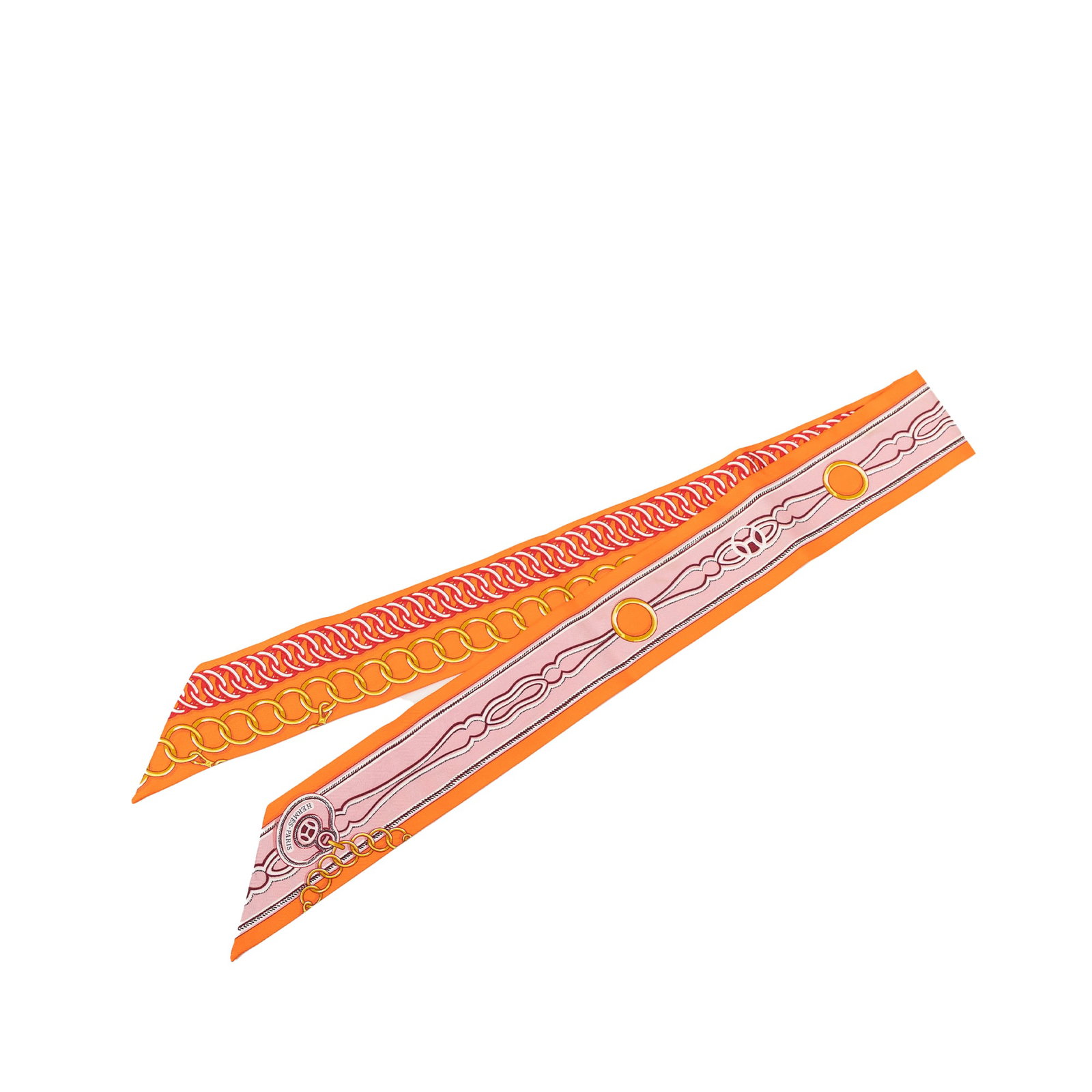 Hermes Maillons Twilly Scarf in Orange Silk: Hermes Maillons Twilly Scarf in Orange Silk Hermes Maillons Silk Twilly Scarf in orange, featuring a printed design on 100% silk. Made in France, this accessory is part of the Maillons Silk Twilly Sca