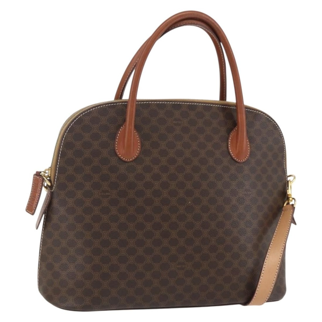 Brown Macadam Canvas PVC Leather 2way Handbag with Strap by CELINE: Brown Macadam Canvas PVC Leather 2way Handbag with Strap by CELINE This CELINE Macadam handbag is crafted from durable PVC leather and features the signature brown and gold Macadam canvas. Designed as