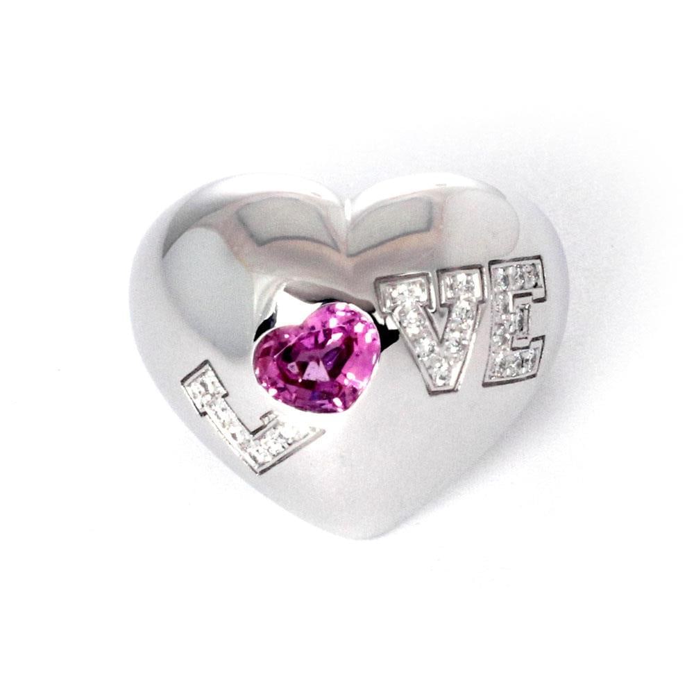 Chopard LOVE Diamond Ring 18k White Gold Heart Pink Sapphire: Chopard LOVE Diamond Ring 18k White Gold Heart Pink Sapphire Presenting an exquisite heart-shaped dome ring by Chopard, crafted from luxurious 18k white gold with a high polished finish. This stunning