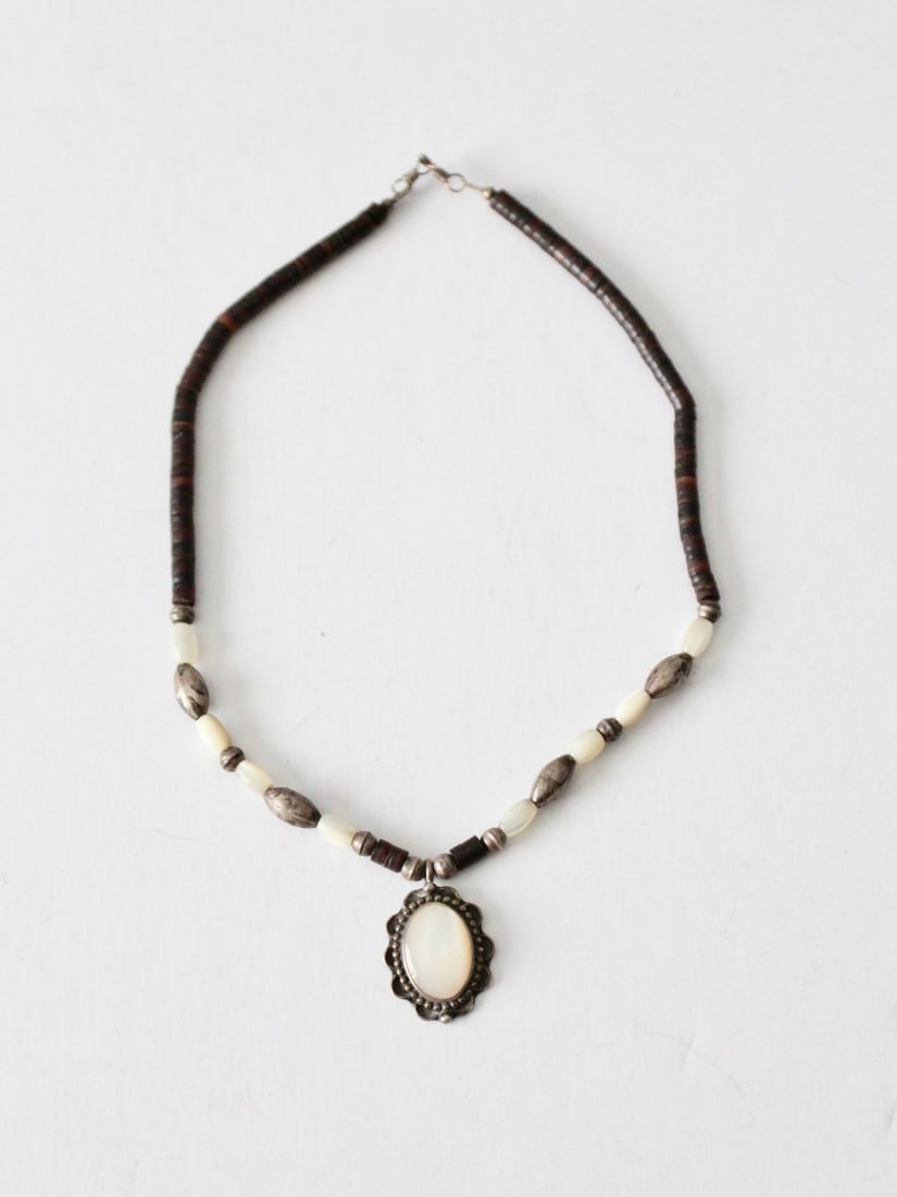 Victorian Style Vintage Beaded Pendant Necklace 15 inch: Victorian Style Vintage Beaded Pendant Necklace 15 inch This vintage beaded pendant necklace showcases a beautiful Victorian style design featuring a white stone set in a silver tone scalloped backing