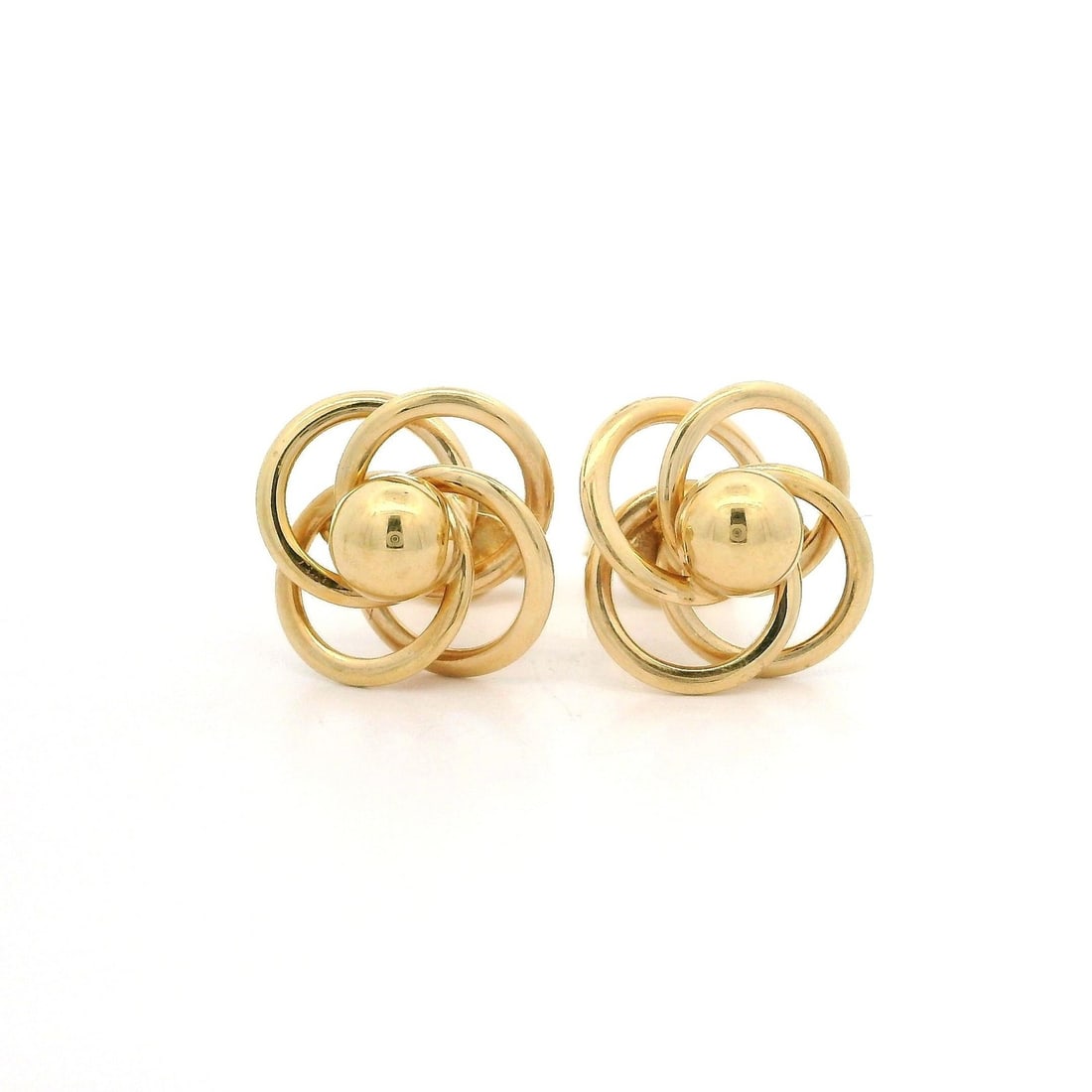 14k Yellow Gold Interlocking Love Knot Stud Earrings: 14k Yellow Gold Interlocking Love Knot Stud Earrings These exquisite stud earrings feature a polished interlocking love knot design, crafted from solid 14k yellow gold. The earrings weigh 2.5 grams an