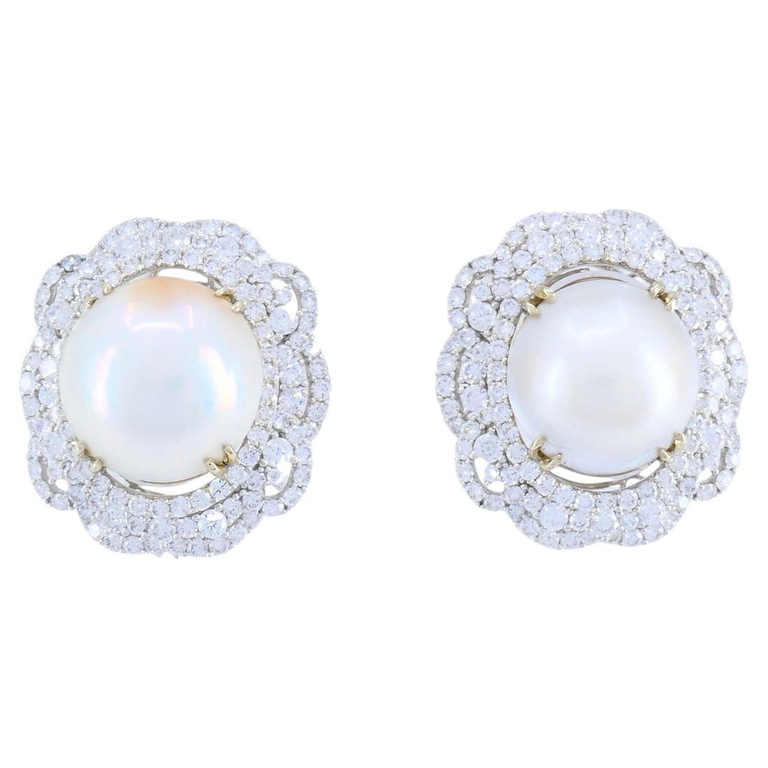 HANA mabe pearl diamond drop earrings in 18K white gold pair: HANA mabe pearl diamond drop earrings in 18K white gold pair Late 20th century HANA drop earrings crafted in 18k white gold with mabe pearls and round brilliant cut diamonds. The sculptural design fea