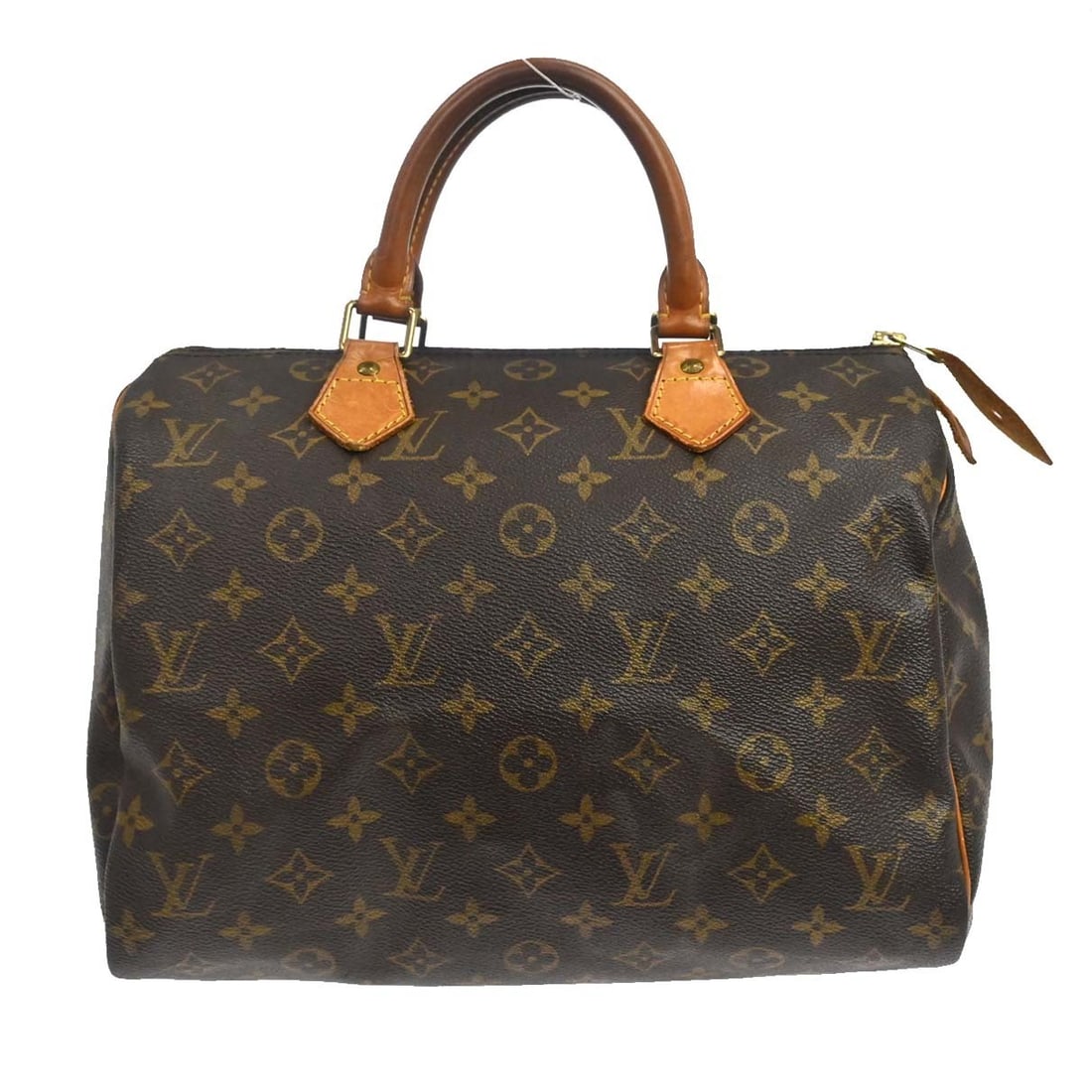 Louis Vuitton Speedy 30 Monogram Canvas Satchel M41526: Louis Vuitton Speedy 30 Monogram Canvas Satchel M41526 Vintage Louis Vuitton Speedy 30 handbag in Monogram canvas with leather double handles and a zip closure. This satchel-style bag features a brown