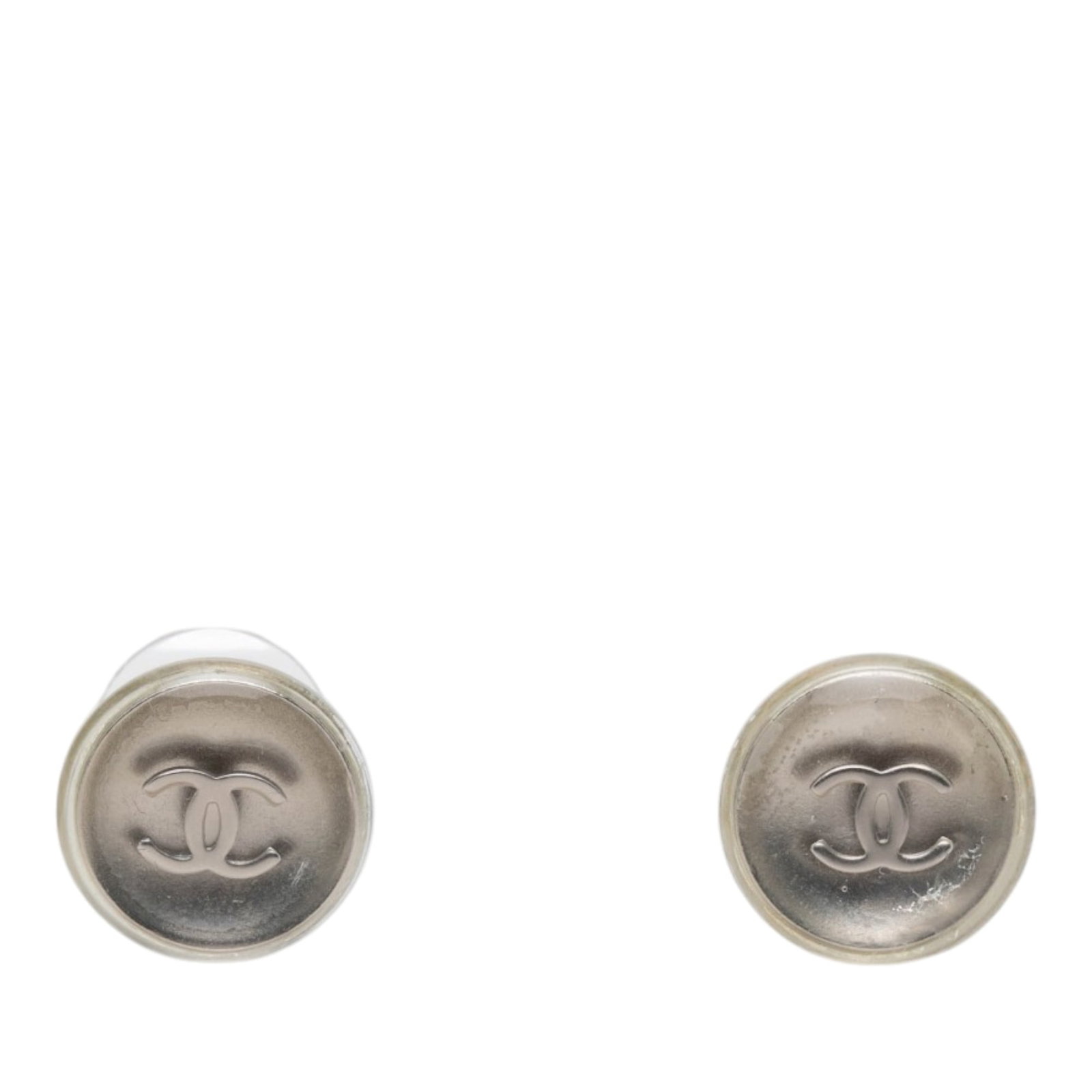 Chanel CC Round Earrings in Resin and Brass Push Back: Chanel CC Round Earrings in Resin and Brass Push Back Round Chanel CC earrings featuring a brass body with resin detail and push back closures. Made in France, this costume jewelry piece is finished i