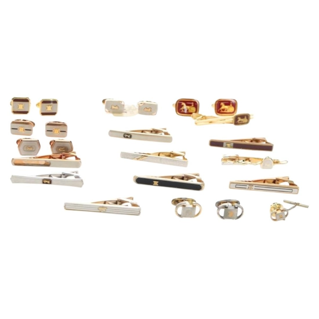 12 Piece Gold Tone Metal Cuff Set by CELINE: 12 Piece Gold Tone Metal Cuff Set by CELINE Set of 12 CELINE gold tone metal cuffs with tie pin styling. Includes the item box. This bundle is offered as a special set, and individual item sizes and d