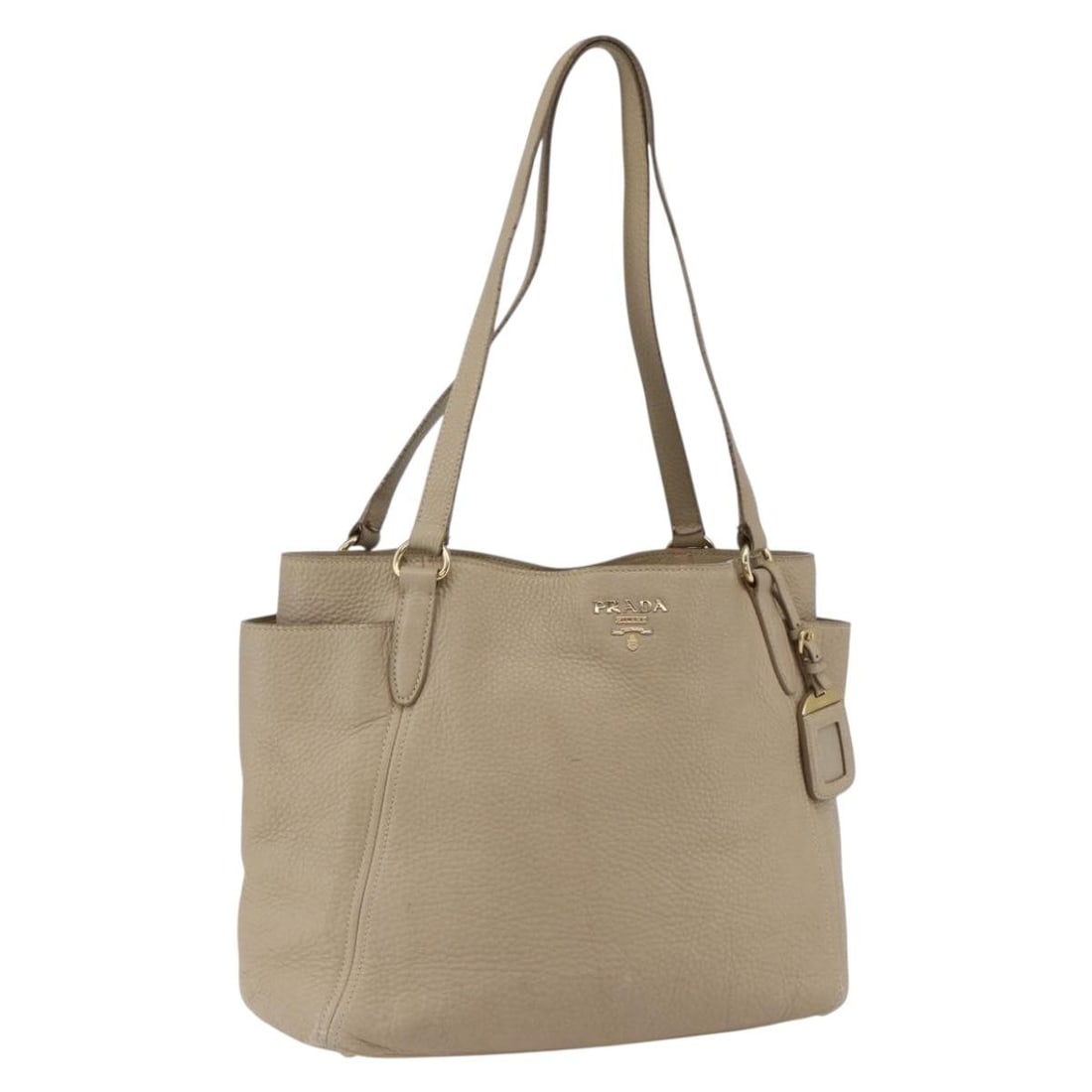 PRADA Leather Tote Handbag Beige Gold with Name Tag: PRADA Leather Tote Handbag Beige Gold with Name Tag Authentic Prada tote bag in beige leather with gold-tone accents. This women's bag includes a name tag and is made in Italy. Condition is heavily us