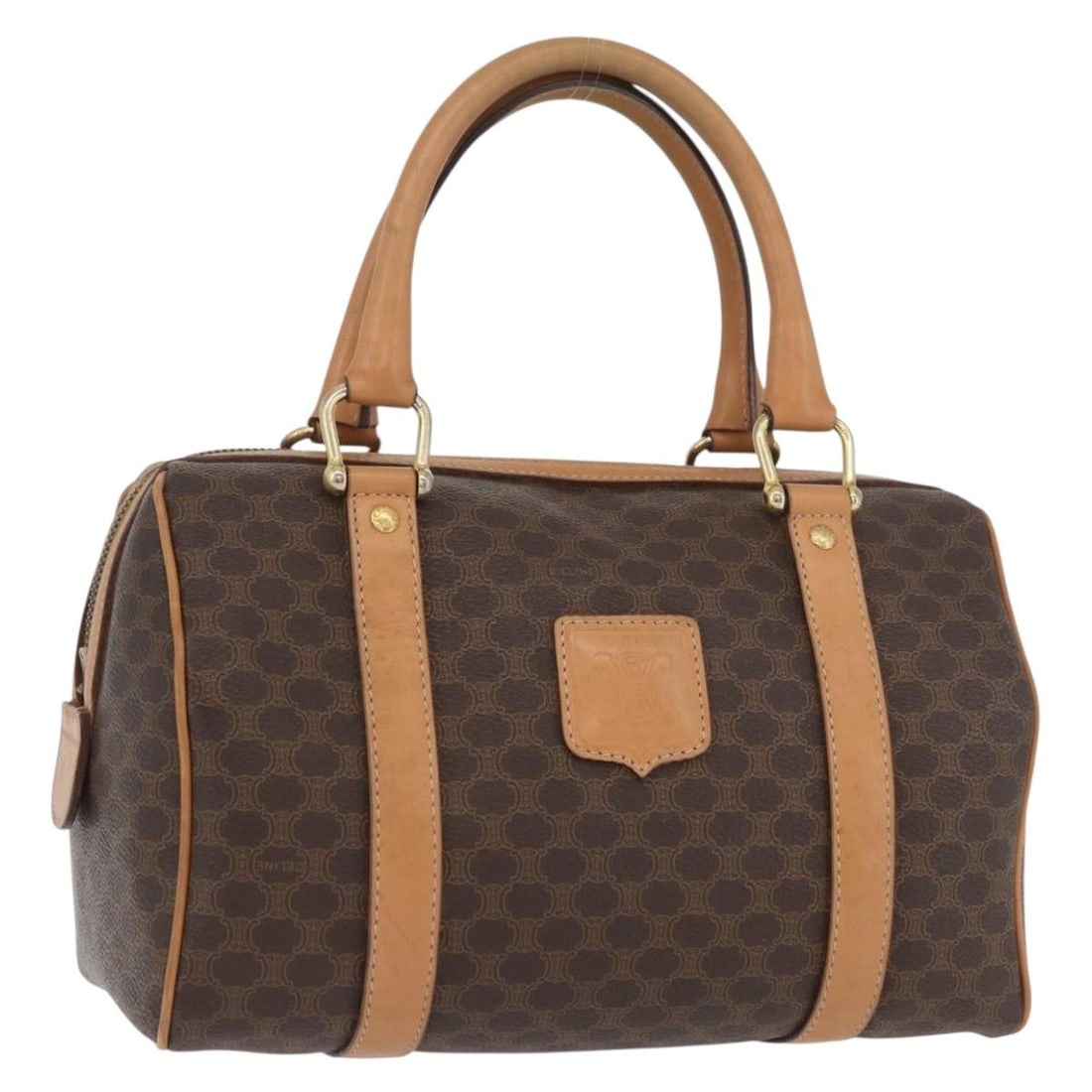 Celine Macadam Brown PVC Leather Handbag with Gold Tone Details: Celine Macadam Brown PVC Leather Handbag with Gold Tone Details This CELINE hand bag features the classic Macadam canvas design with PVC leather accents in brown and gold tones. Designed for women, it