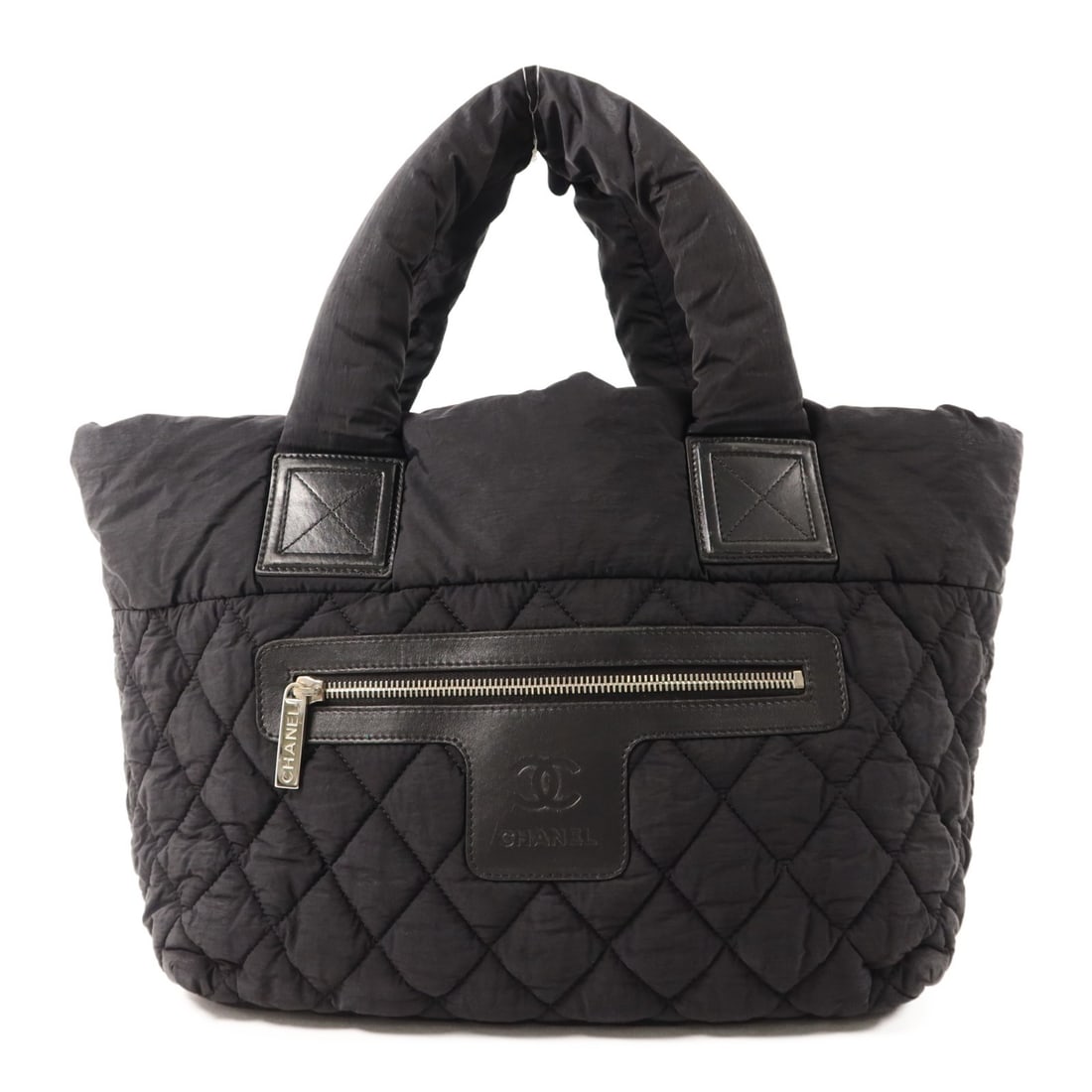CHANEL CC Black Nylon Handbag with Silver Tone Hardware: CHANEL CC Black Nylon Handbag with Silver Tone Hardware Black CHANEL handbag in nylon with a black exterior and black frame color. It is a women's regular-size handbag made in France, with one outside