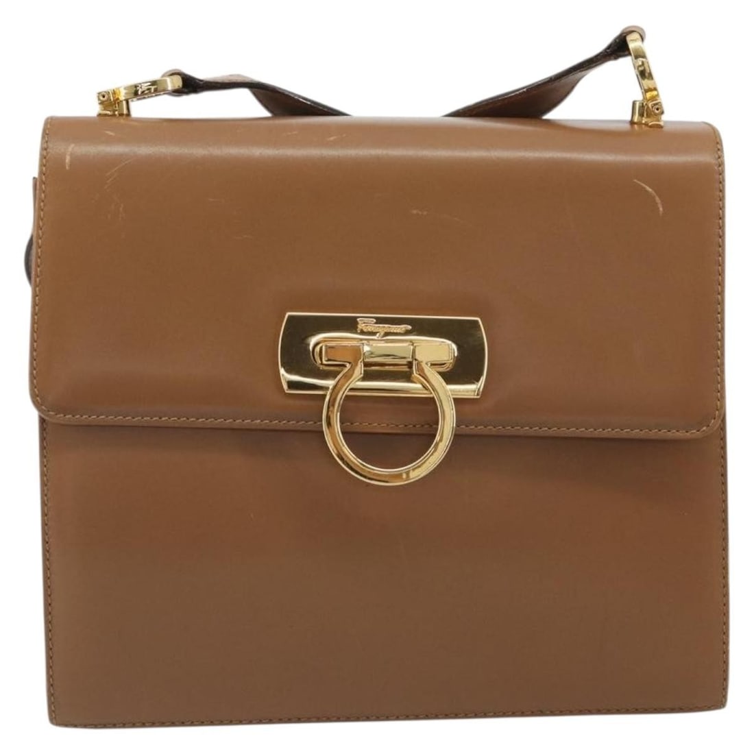 Salvatore Ferragamo Gancini Brown Leather Shoulder Bag: Salvatore Ferragamo Gancini Brown Leather Shoulder Bag Salvatore Ferragamo Gancini leather item in brown, designed for female use. Made in Italy, it measures 21 cm x 19 cm x 7 cm. The item is in good 