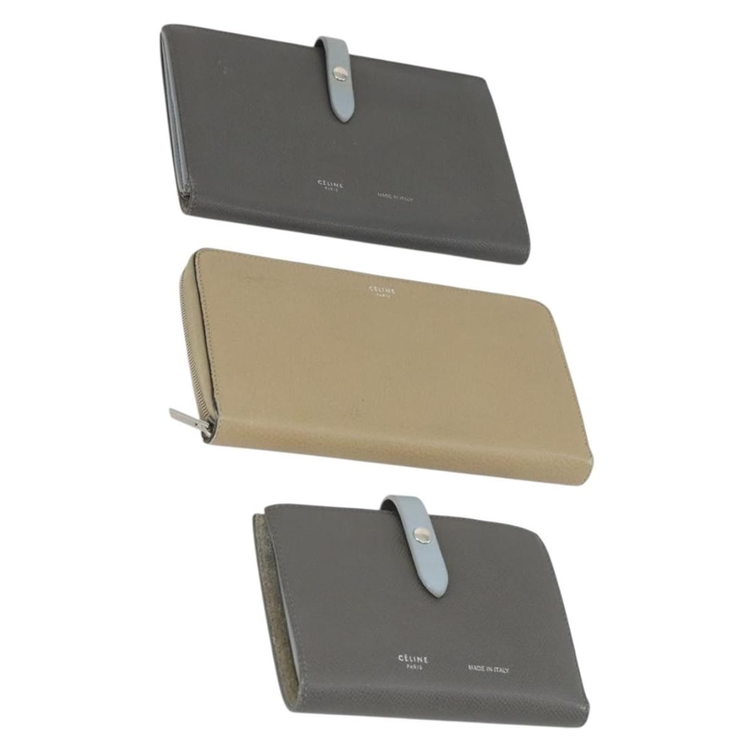 CELINE Leather Wallet Set of 3 Gray Beige Authentic: CELINE Leather Wallet Set of 3 Gray Beige Authentic This CELINE wallet set features a stylish combination of gray and beige leather, exuding sophistication. Crafted in Italy, this wallet showcases the